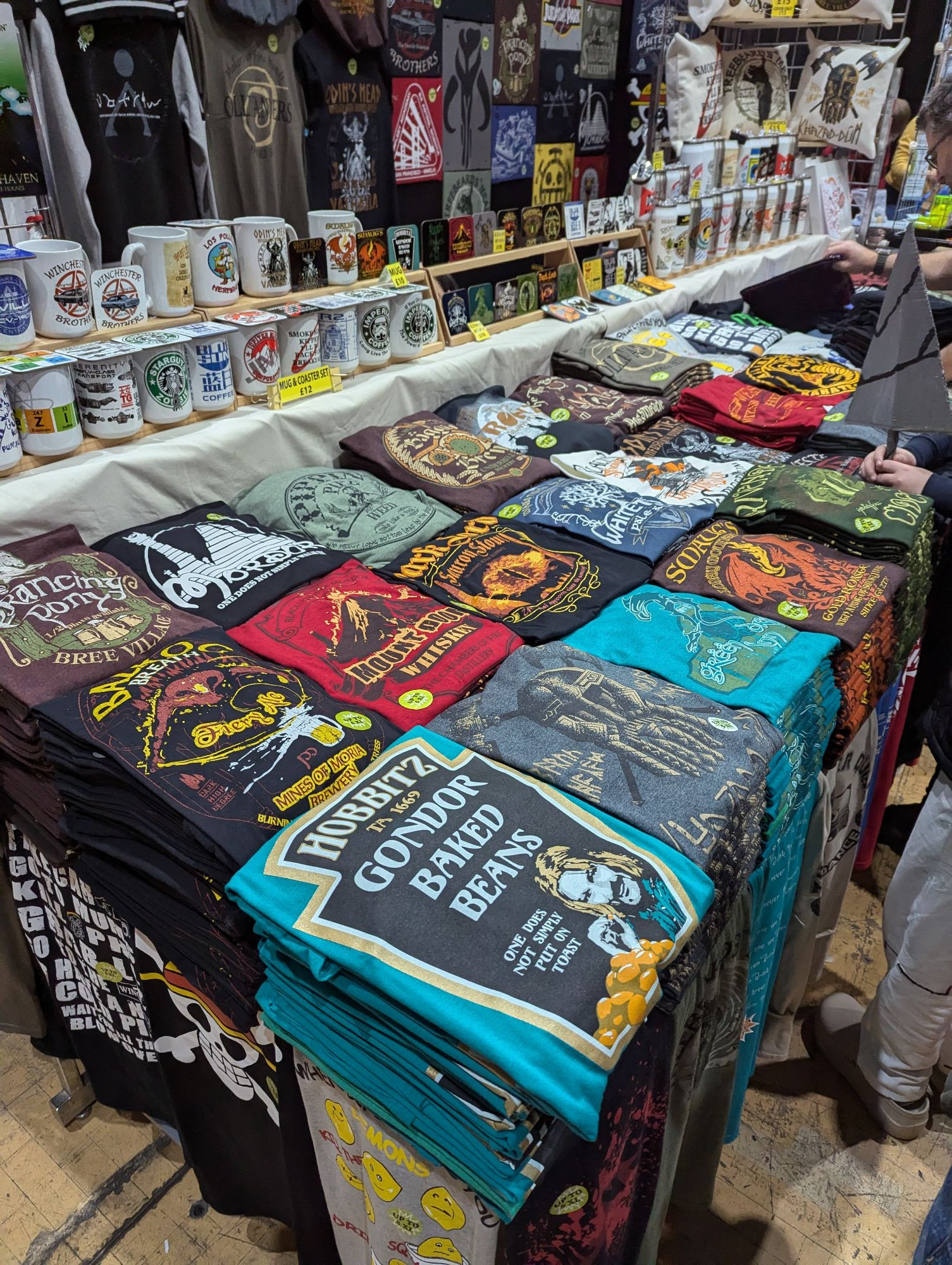 T-shirt stand with some fun modern pop culture  tees