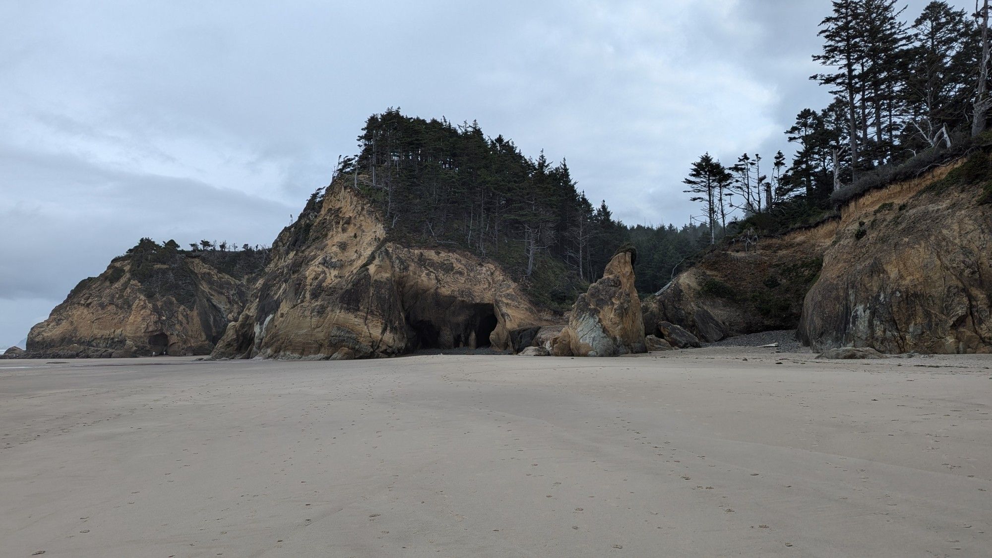 Hug Point. Lots of rocky cliff formations with cut outs and a waterfall.