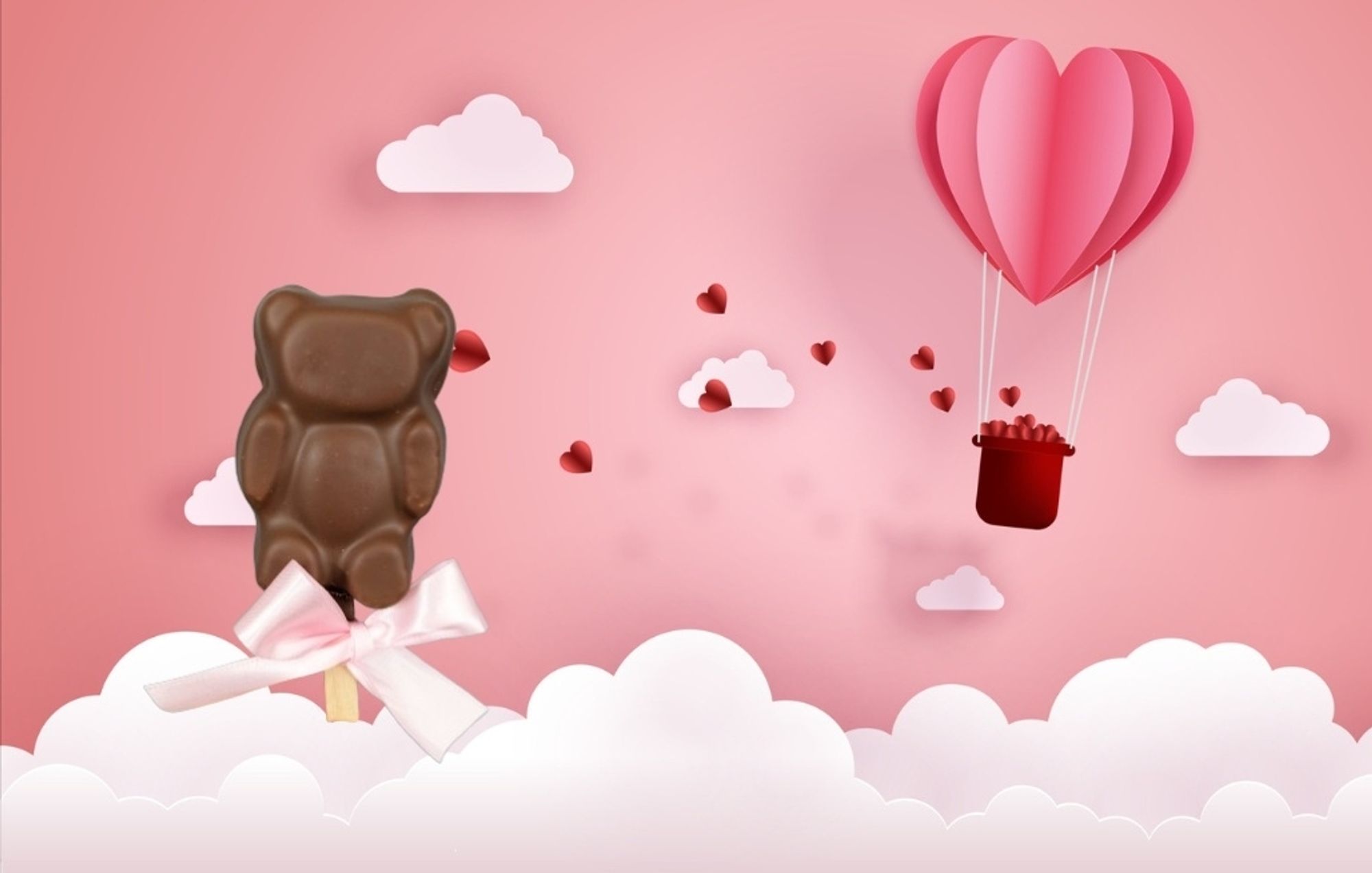 Ourson guimauve chocolat au lait sur bâton dans un décor de St Valentin avec nuage et montgolfière en papier