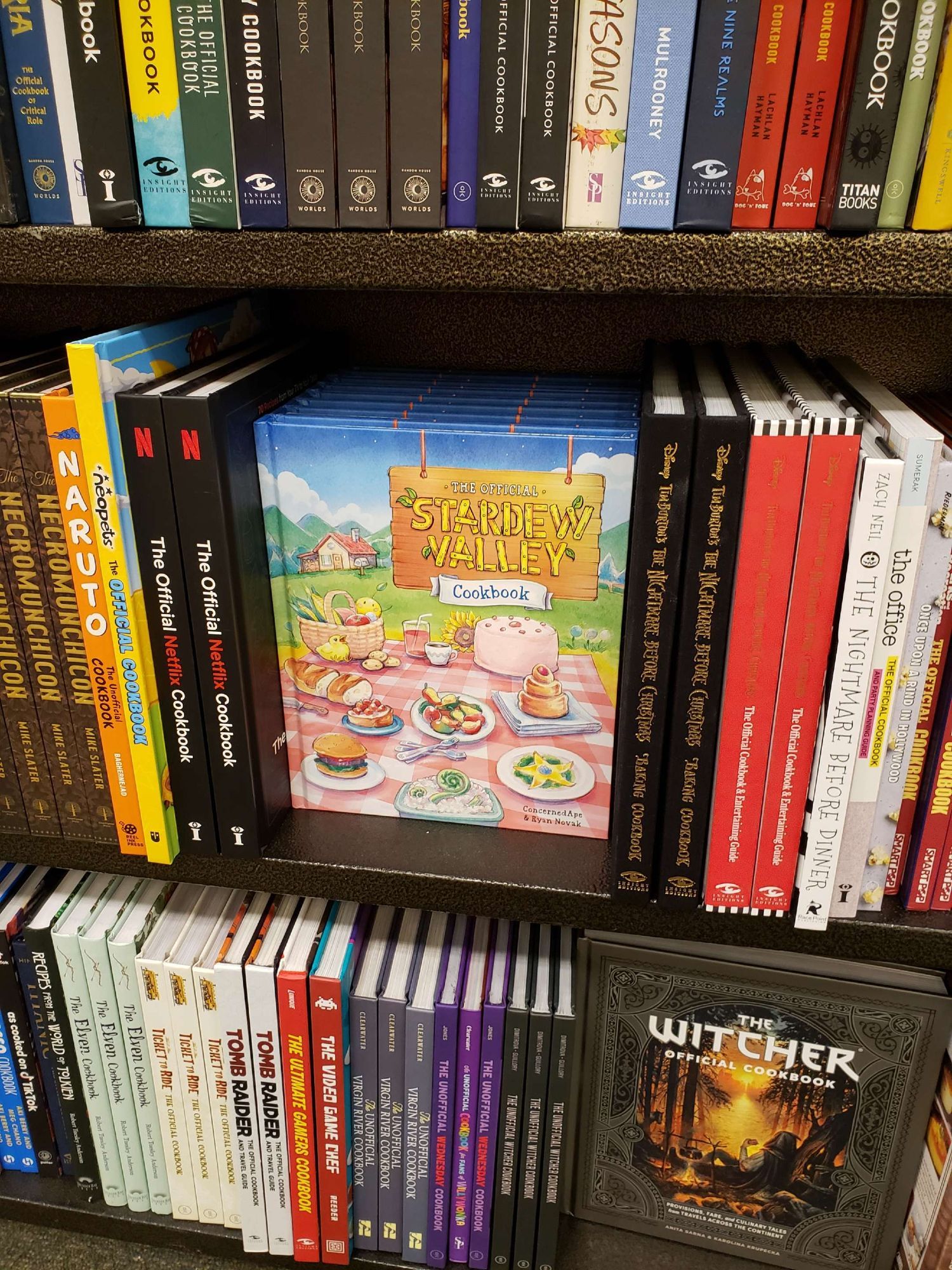 Several copies of the Stardew Valley Cookbook on the shelf at Barnes & Noble