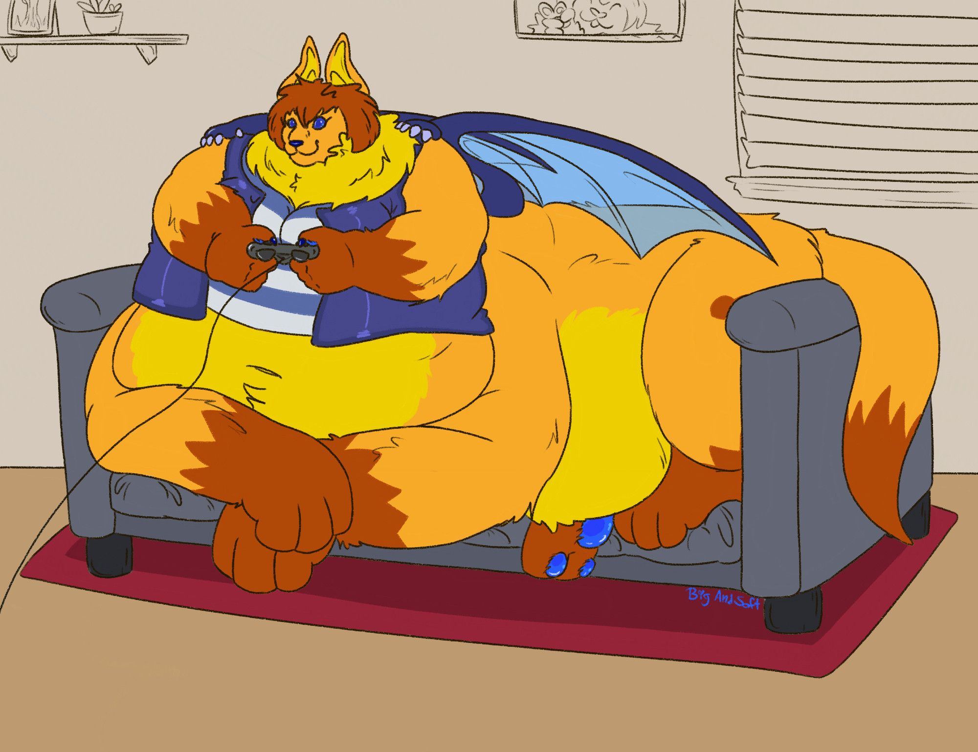 K, a large orange and yellow bat taur sits comfortably, but a bit squished, on a grey couch with a red rug on the floor beneath it. They are holding a game controller in their hands and focusing on something off screen. In the background there is a small shelf with a picture and plant, a photo hanging of K throwing a peace sign, and a window with the blinds down.