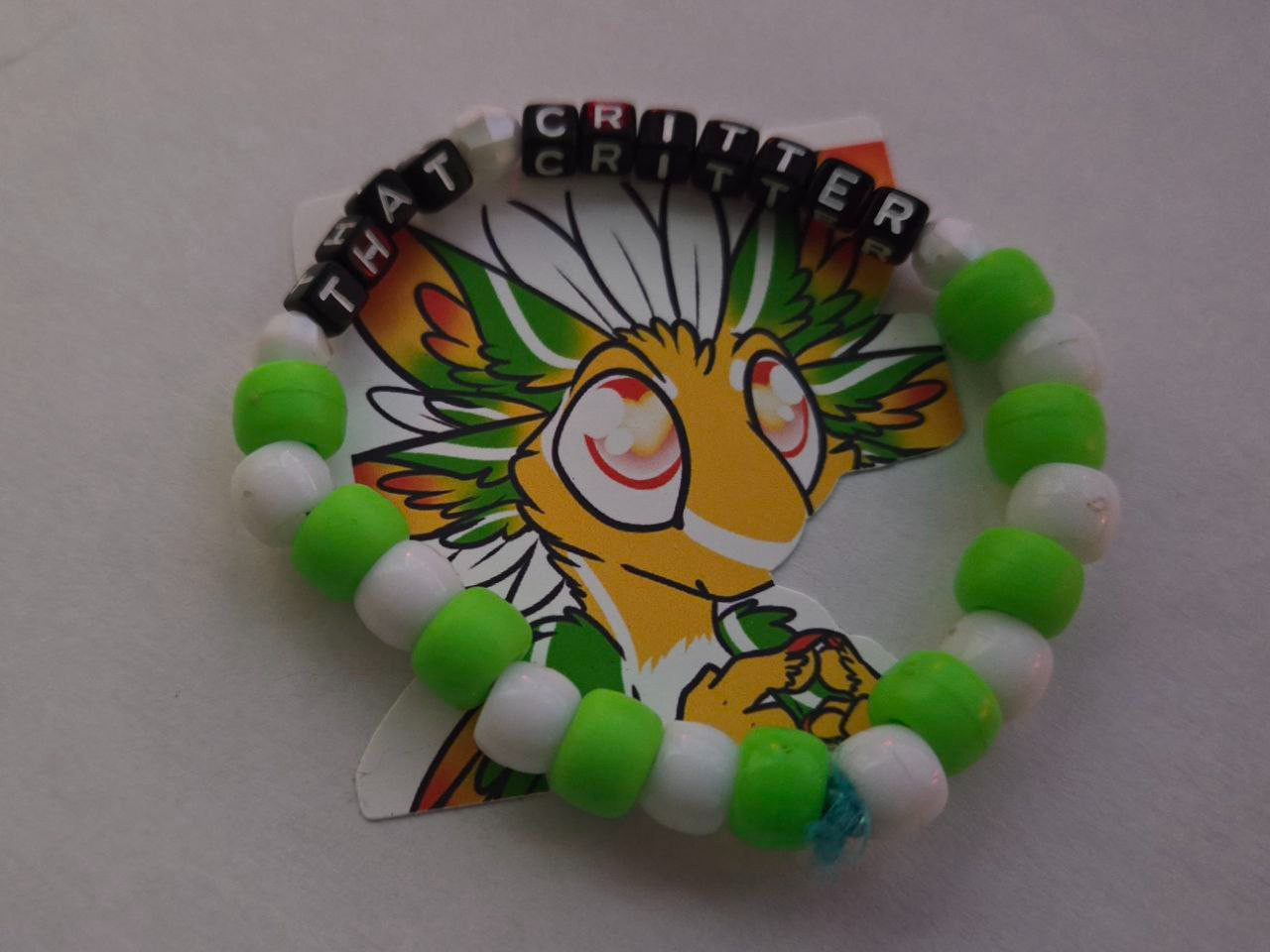 Kandi bracelet that reads "That Critter"