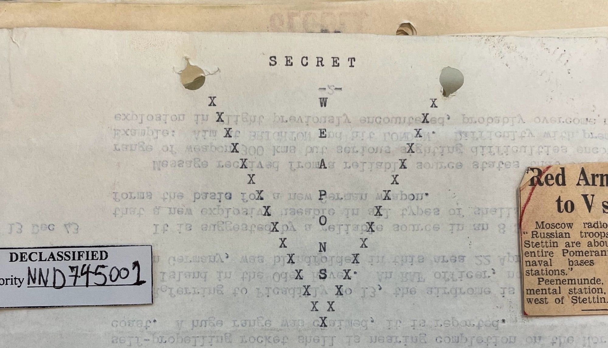 archival photo of a typewritten report entitled "Secret Weapons" where the word "Secret" is just written normal and horizontally, but "weapons" is written vertically, one letter per line and flanked by a V-for-Victory typed with little Xs