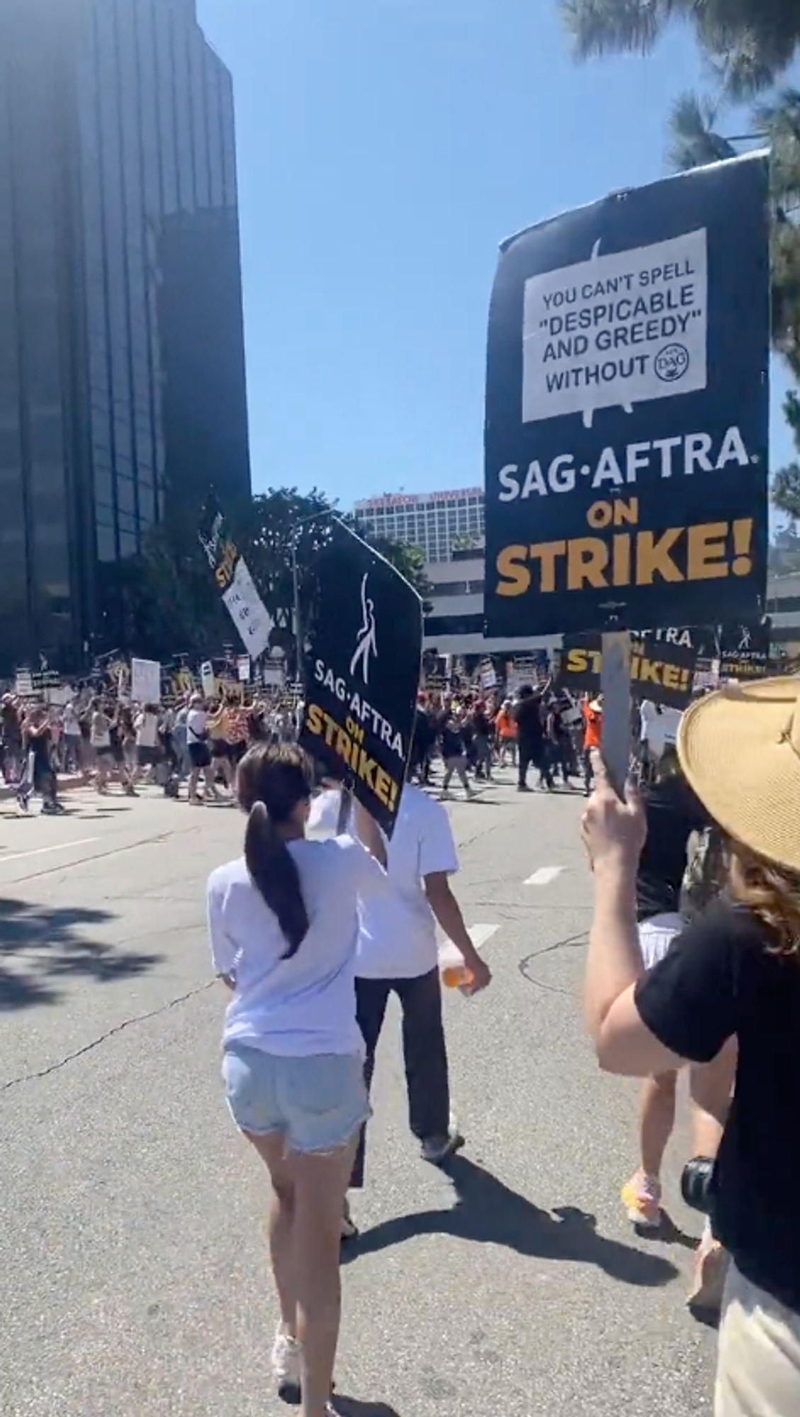 SAG picketers entering the big road next to Universal