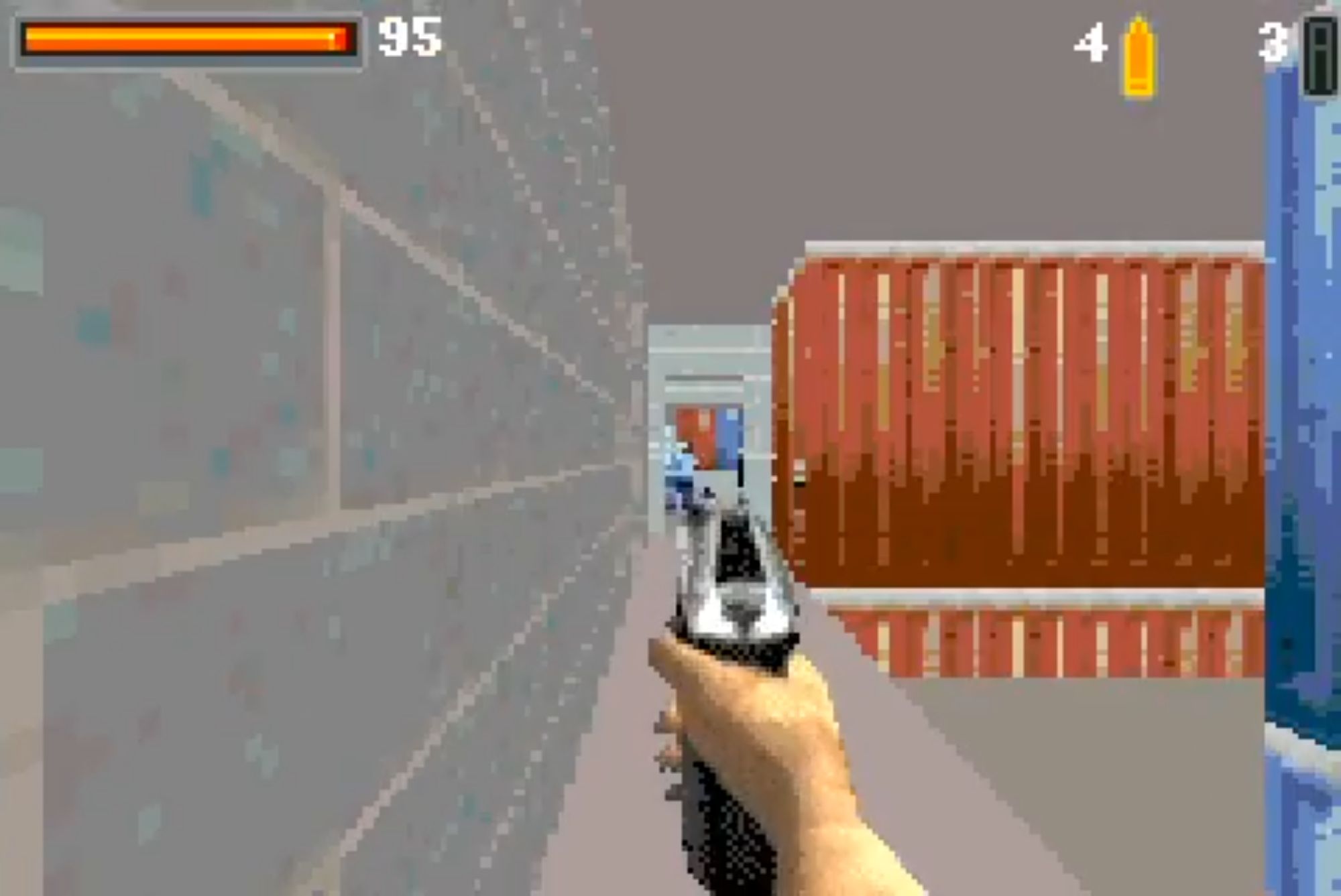 A view down one of the edge raised pathways, which your character is pointing a pistol down. In the distance is a doorway with an enemy in a blue shirt.