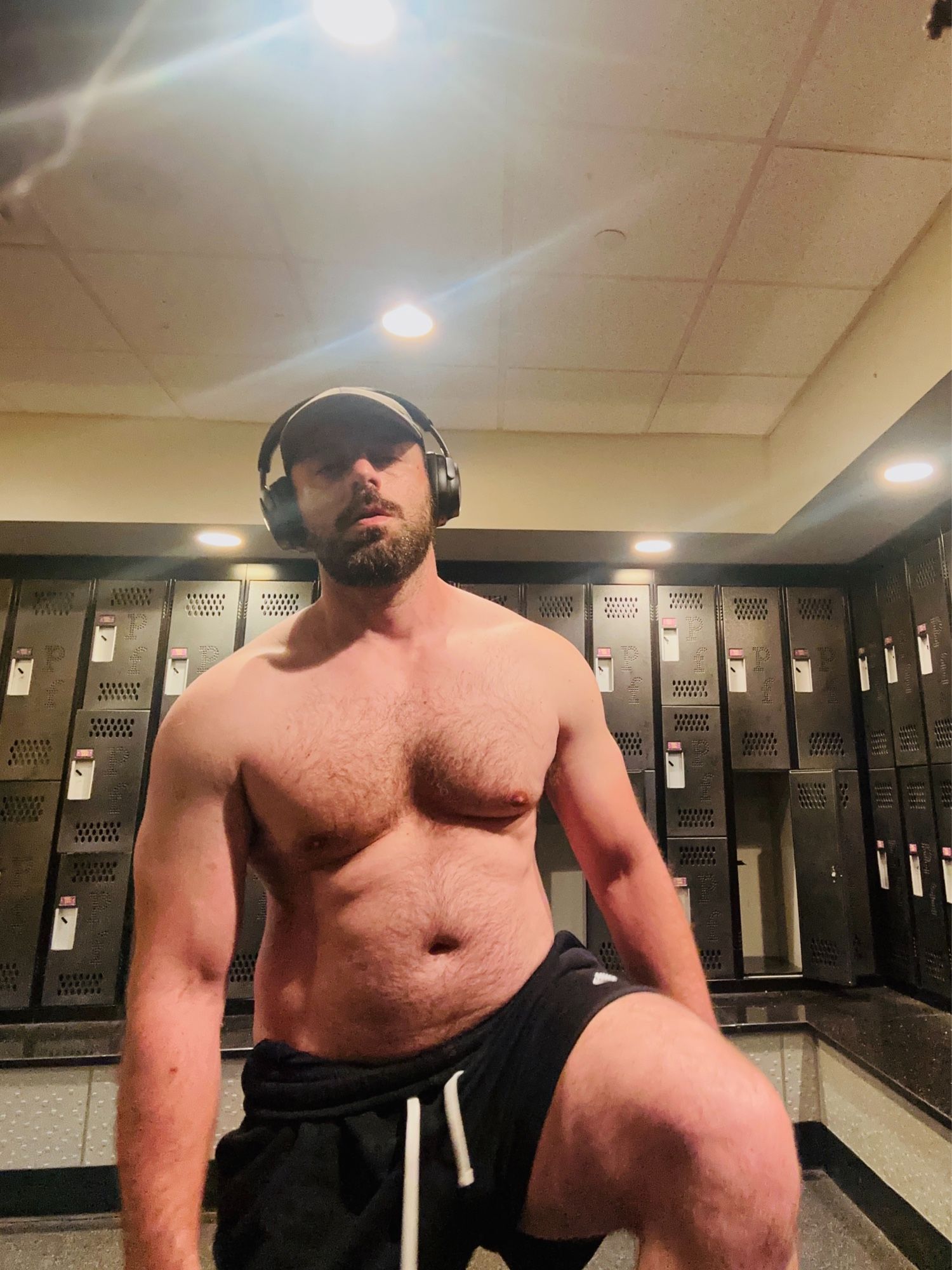 Man looking “uncomfortable” in locker room with black shorts