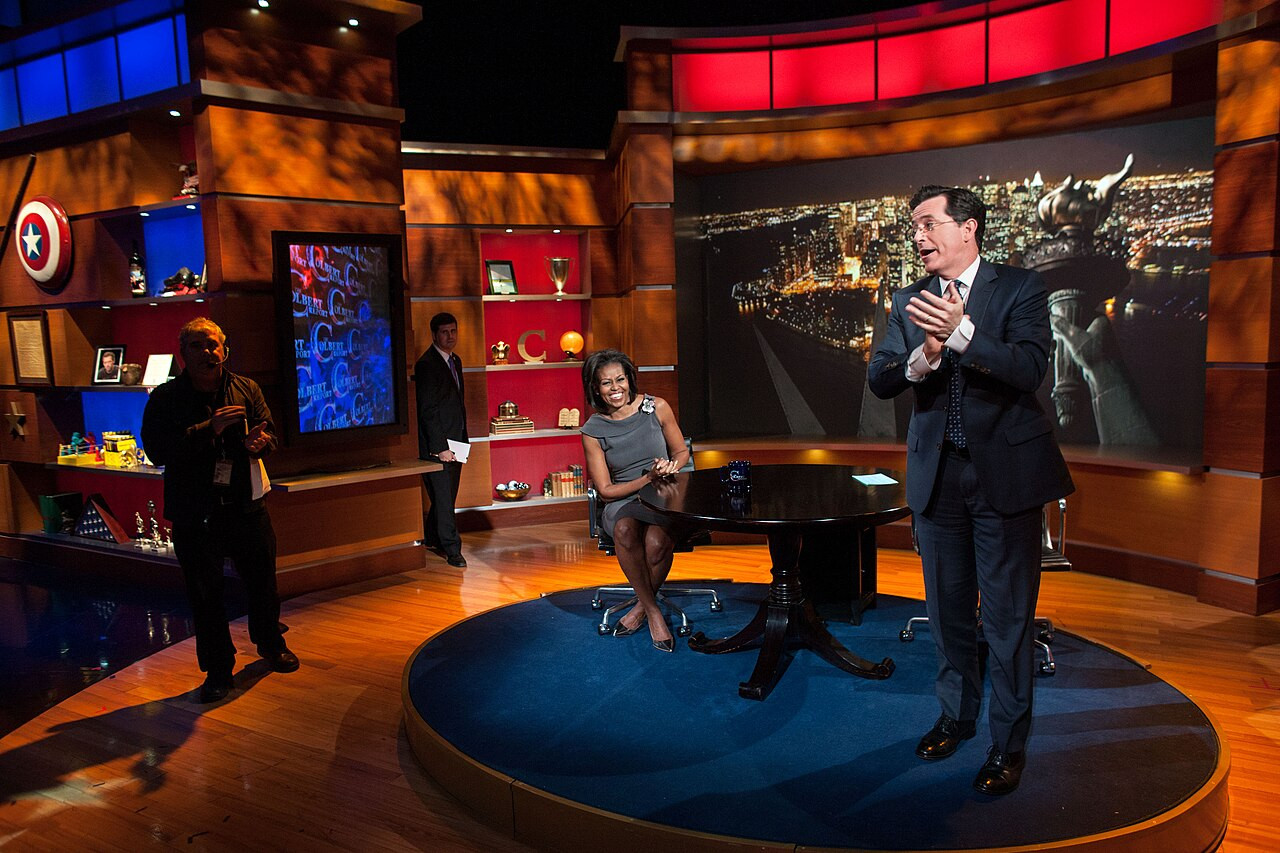 Colbert on the show's set, preparing to interview First Lady Michelle Obama in 2012