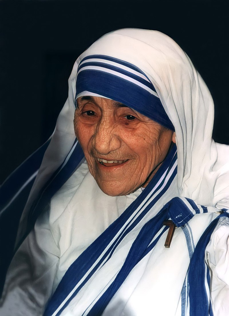 Mother Teresa in her usual white habit with blue bands.