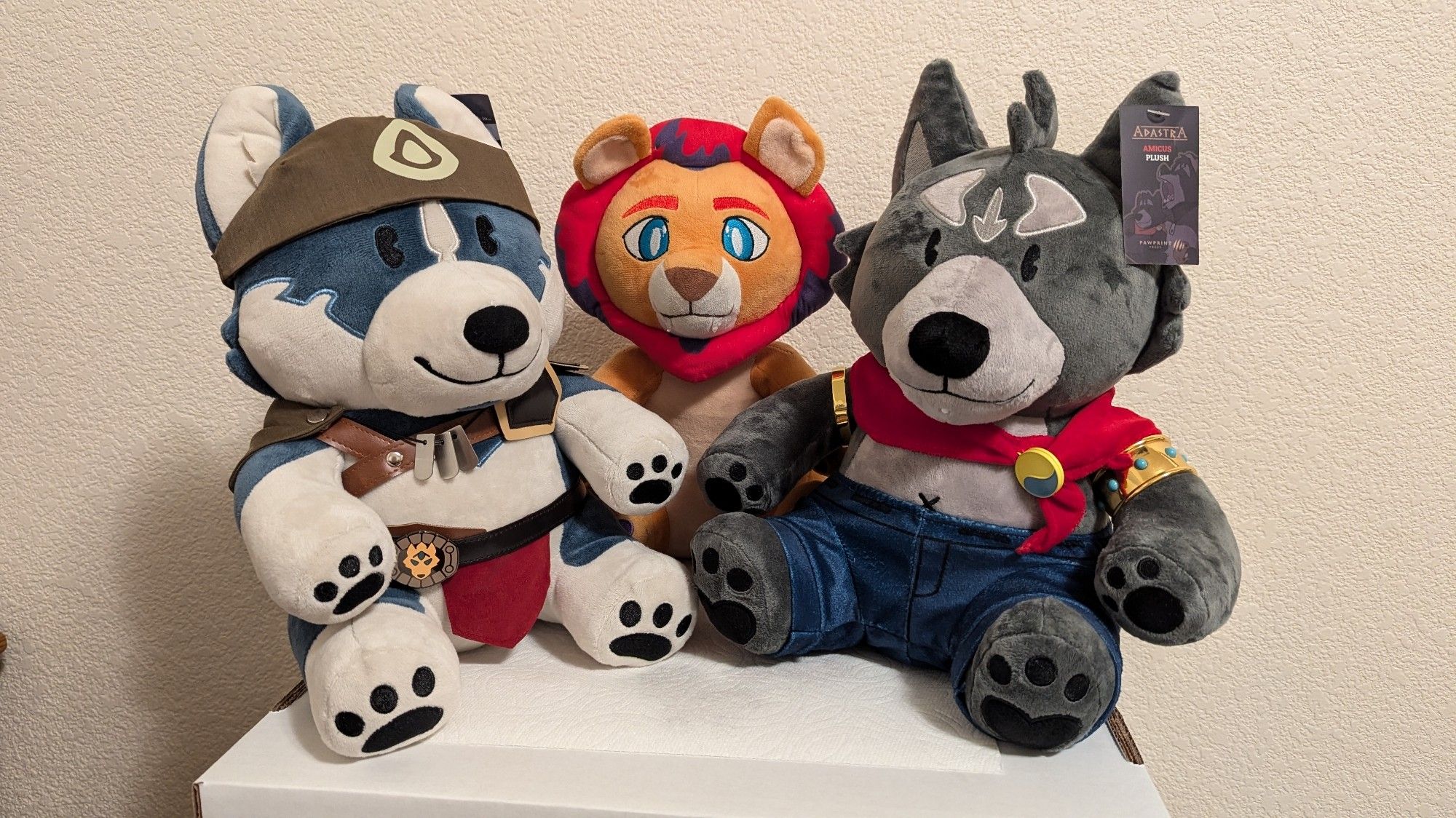 Volga and Amicus plushies together with a third special guest. Looks like he wants a hug...