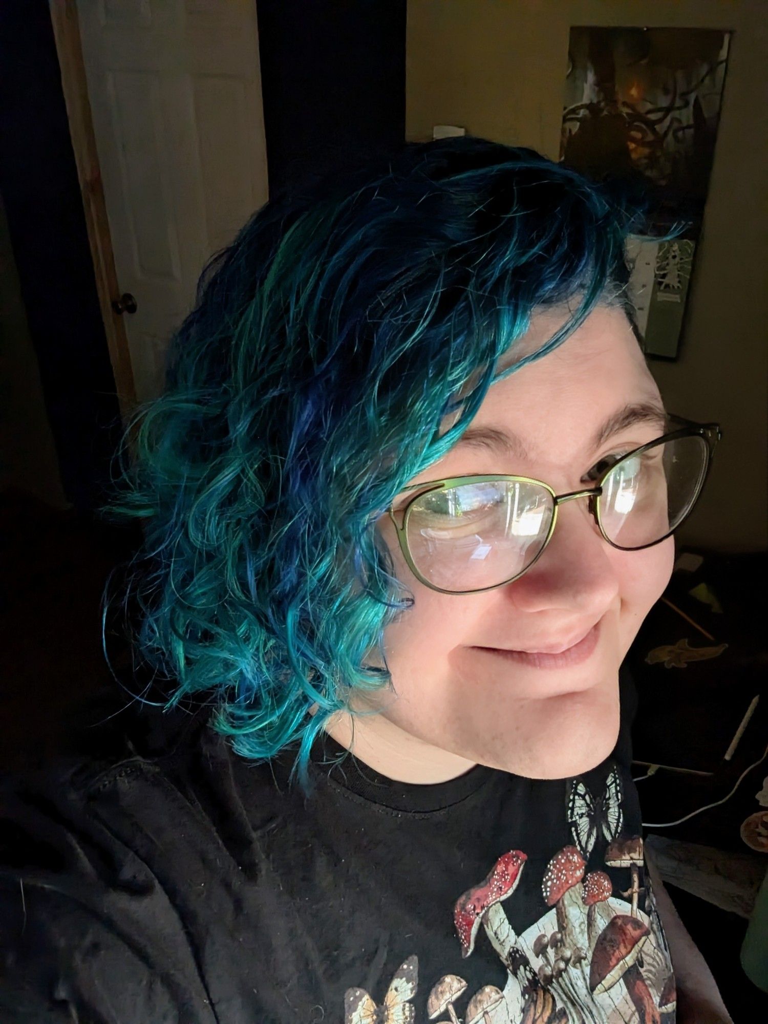 Smiling with my new haircut and blue/teal mermaid hair