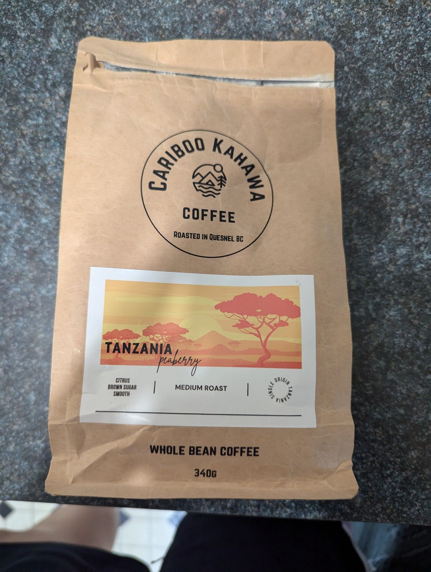 A bag of coffee beans from Caribou Kahawa in Smithers. The tasting notes given are citrus, brown sugar and "smooth". It's a single origin coffee from Tanzania.