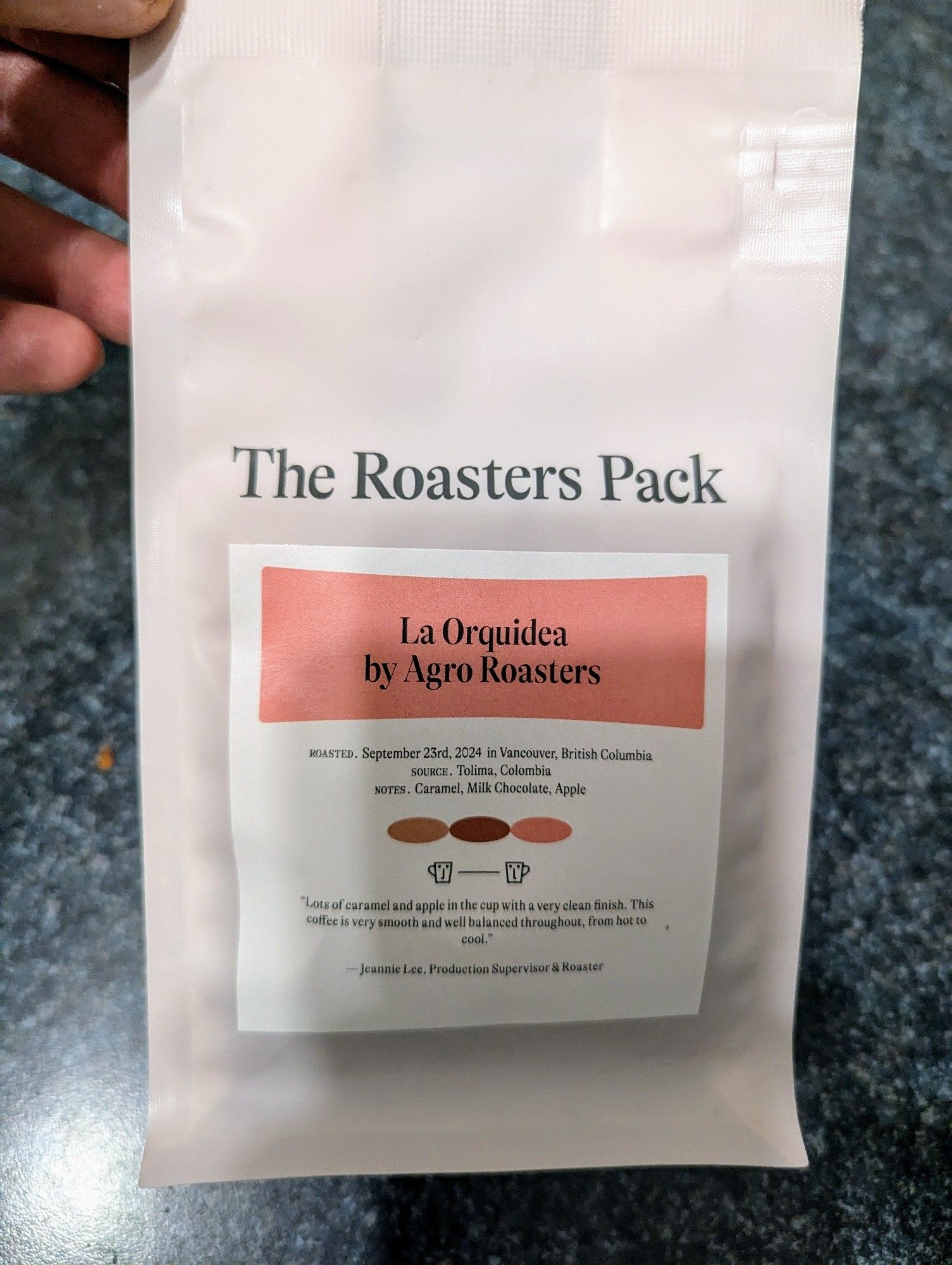 A bag of coffee from my Roasters Pack. The coffee is called La Orquidea by Agro Roasters in Vancouver. The coffee source is Tolima, Colombia. The tasting notes are caramel, milk chocolate, and apple.