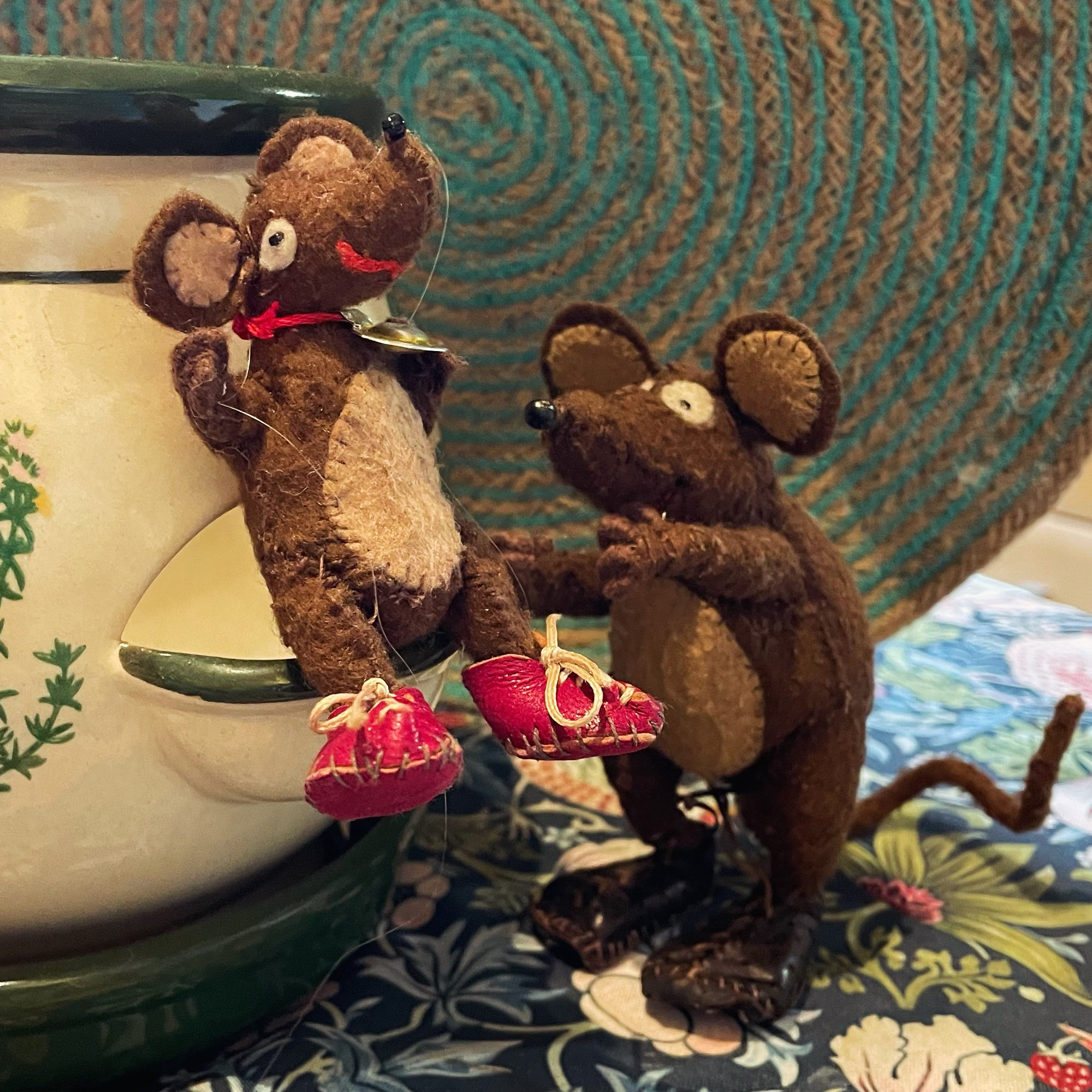 Photo of Minimus and Silvius, the Latin mice. Silvius is perched on a herb planter that looks suspiciously like a mouse-sized public toilet. Minimus is keeping a watchful eye on him, as he is rather high off the ground!