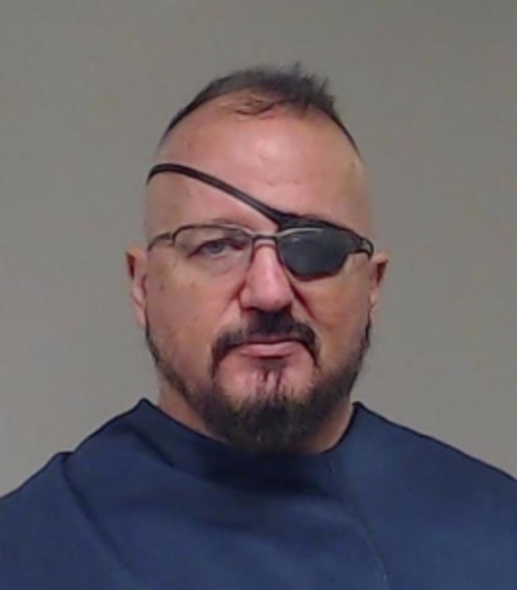 Stewart Rhodes, wearing an eye patch.