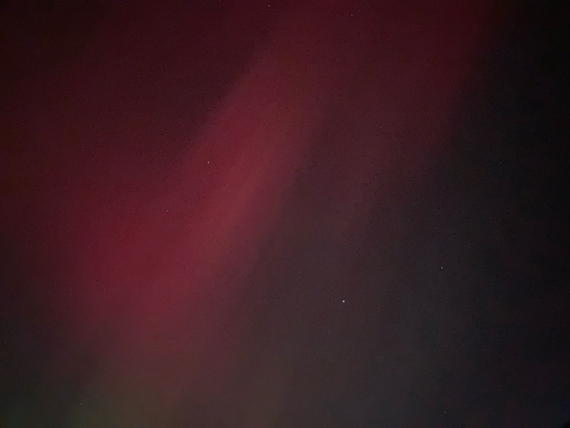 Red streaks of light with, I think, Jupiter visible.