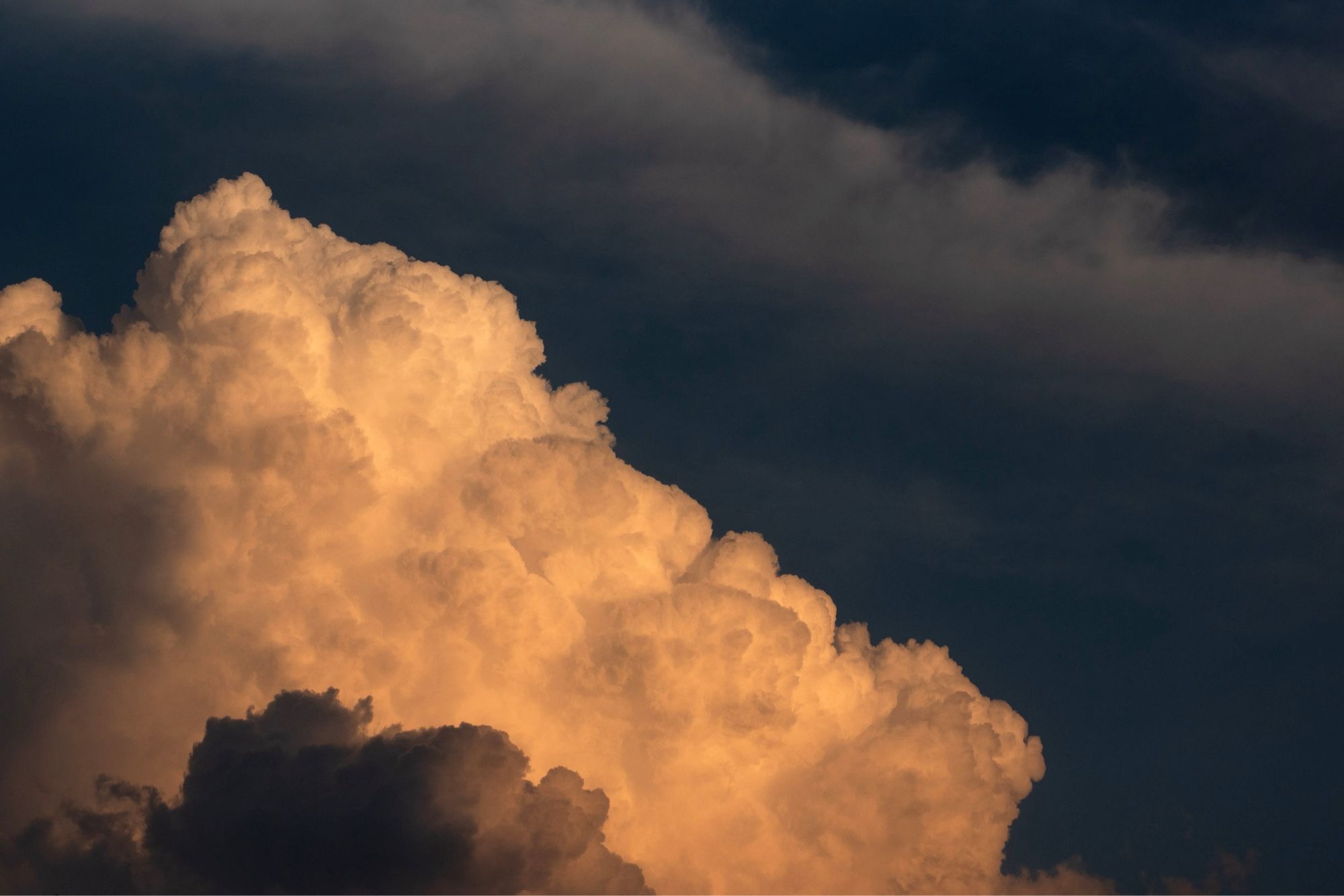 Thick, puffy clouds dominate the skies just after sunset over London, Ontario, Canada.