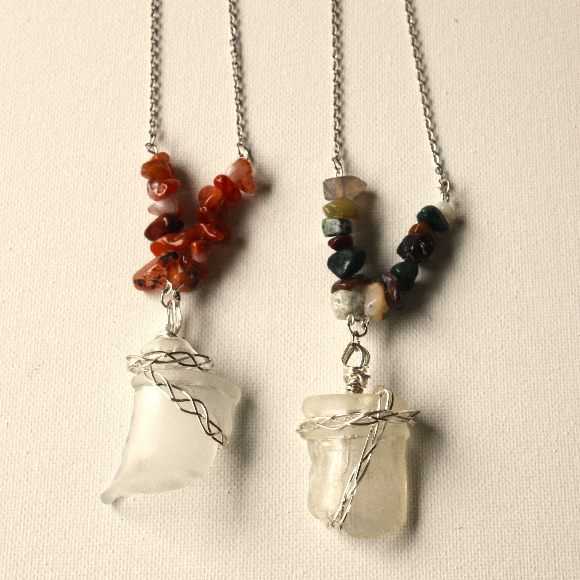 Image of two necklaces that have pendants made from broken bottle top sea glass wrapped in braided silver wire. Decorating the silver chains are sections of small polished stones, the one on the left made from pink dyed agate, and the one on the right made from fancy jasper in various colors.