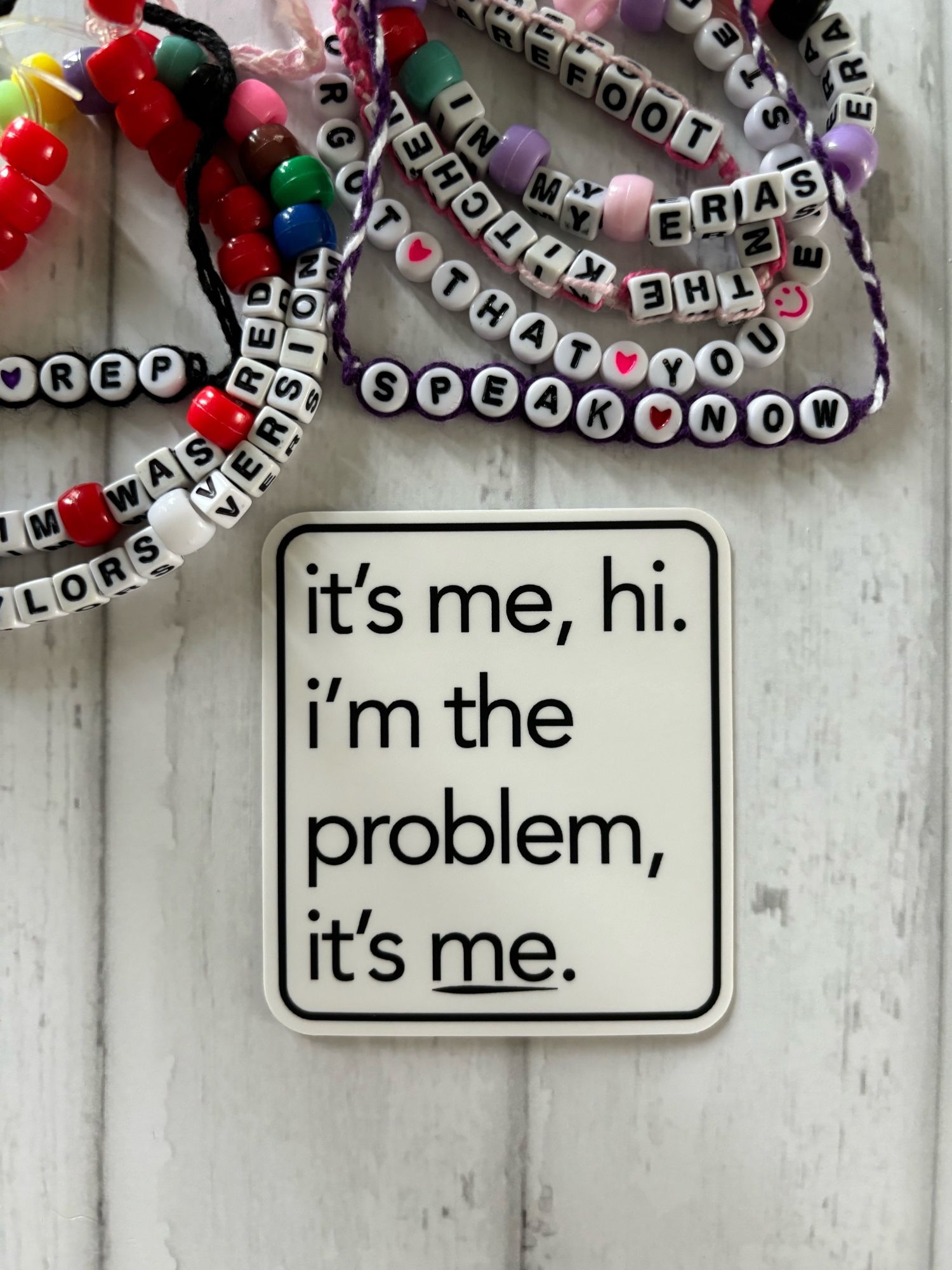 Photo of a vinyl sticker that reads “it’s me, hi. I’m the problem, it’s me.”