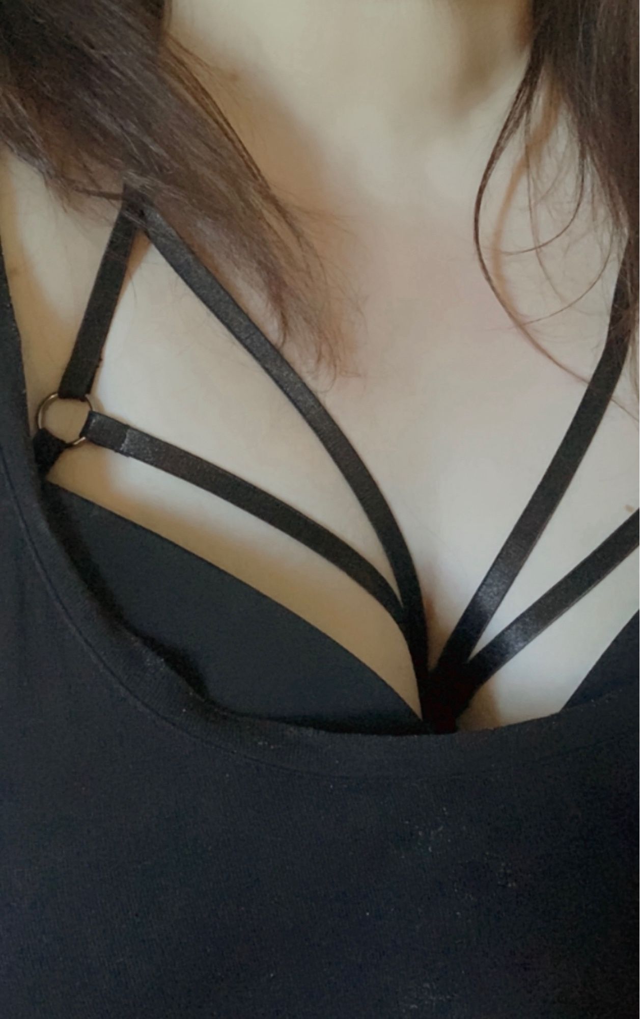 Close up of a woman in a cage bra