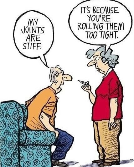 A cartoon depicts an elderly man (getting up from the couch) lamenting: My joints are stiff. An elderly woman stands in front of him with a joint in her hand and says: You're rolling them too tight.