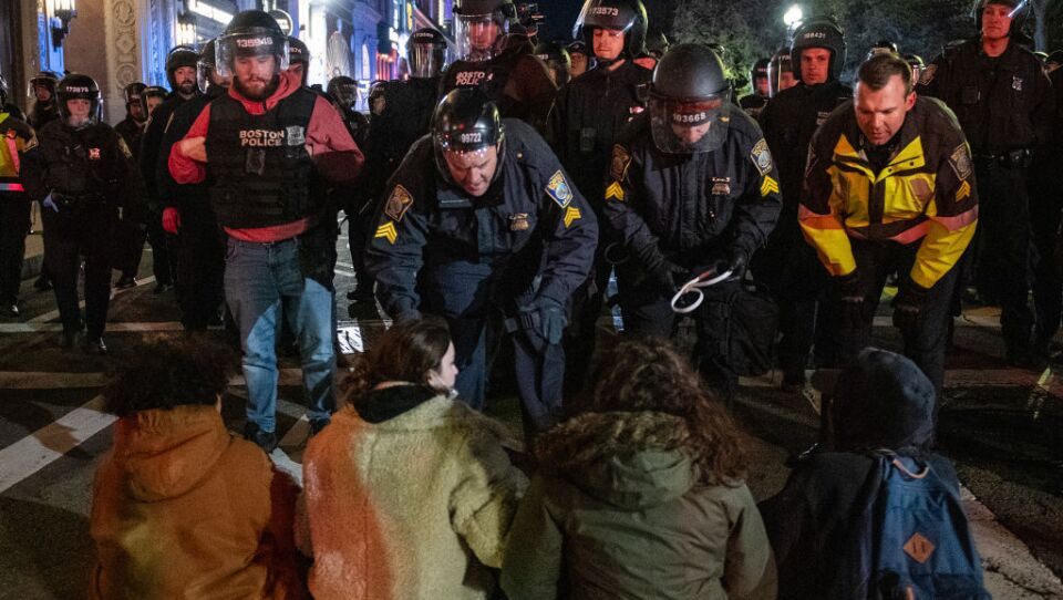 Usually in these mass arrests, disorderly conduct charges are dropped if the charged keep their nose clean for a year. One sanction that should not be set aside is whatever dress code violation the Boston cop got for wearing a red hoodie and blue jeans opted while in the first rank of a police line.