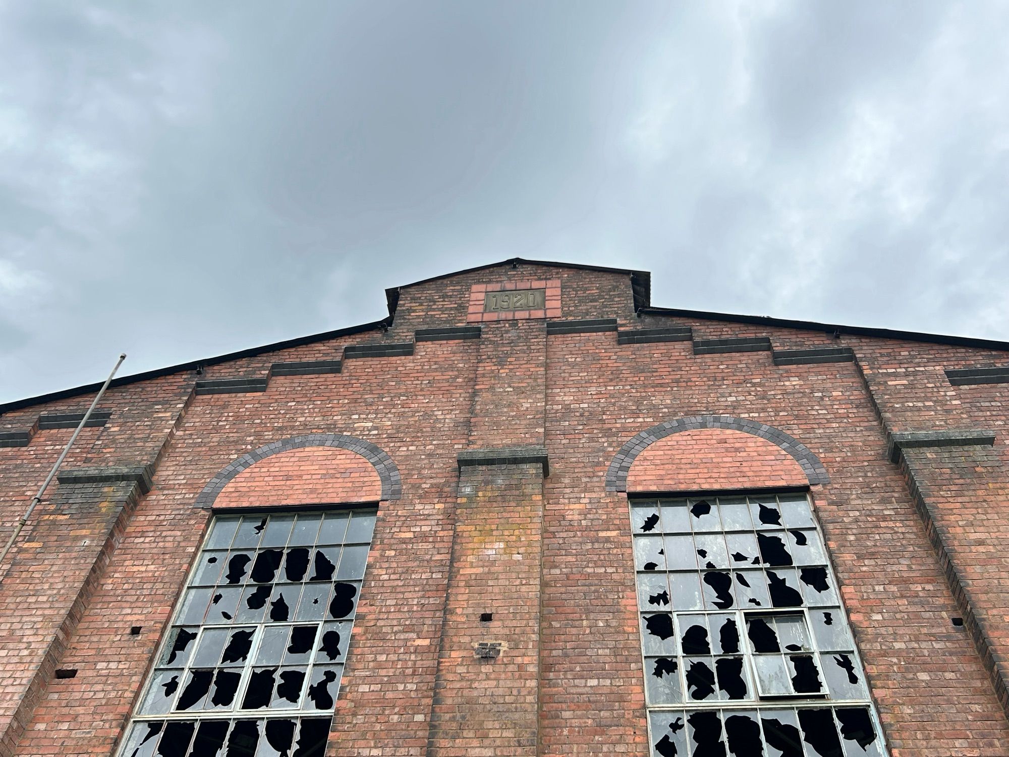 The apex of a red brick building built in 1920 with many broken windows… soon to be the start of the visitor experience