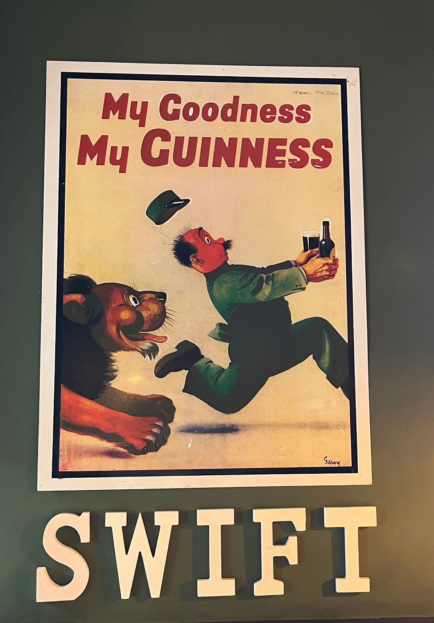 A 'My Goodness My Guinness' Lion poster with the word 'SWIFT underneath