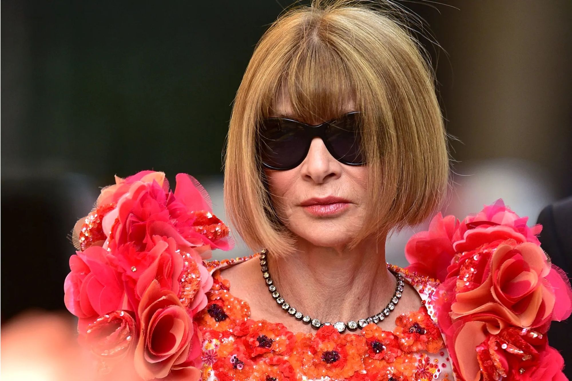 Photo of Anna Wintour in her trademark dark sunglasses.