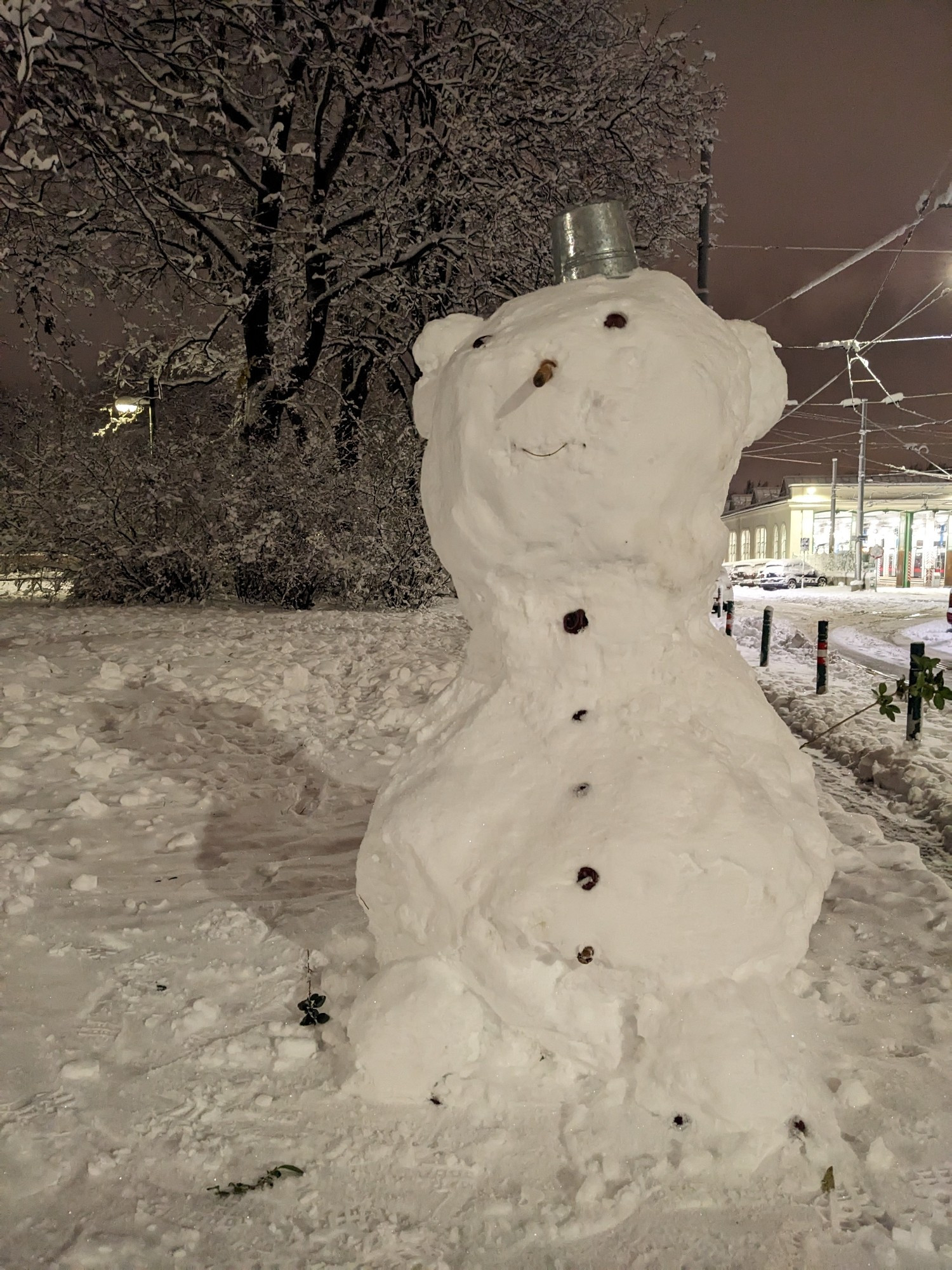 snowman proudly wearing a tin can as a an elegant tiny hat