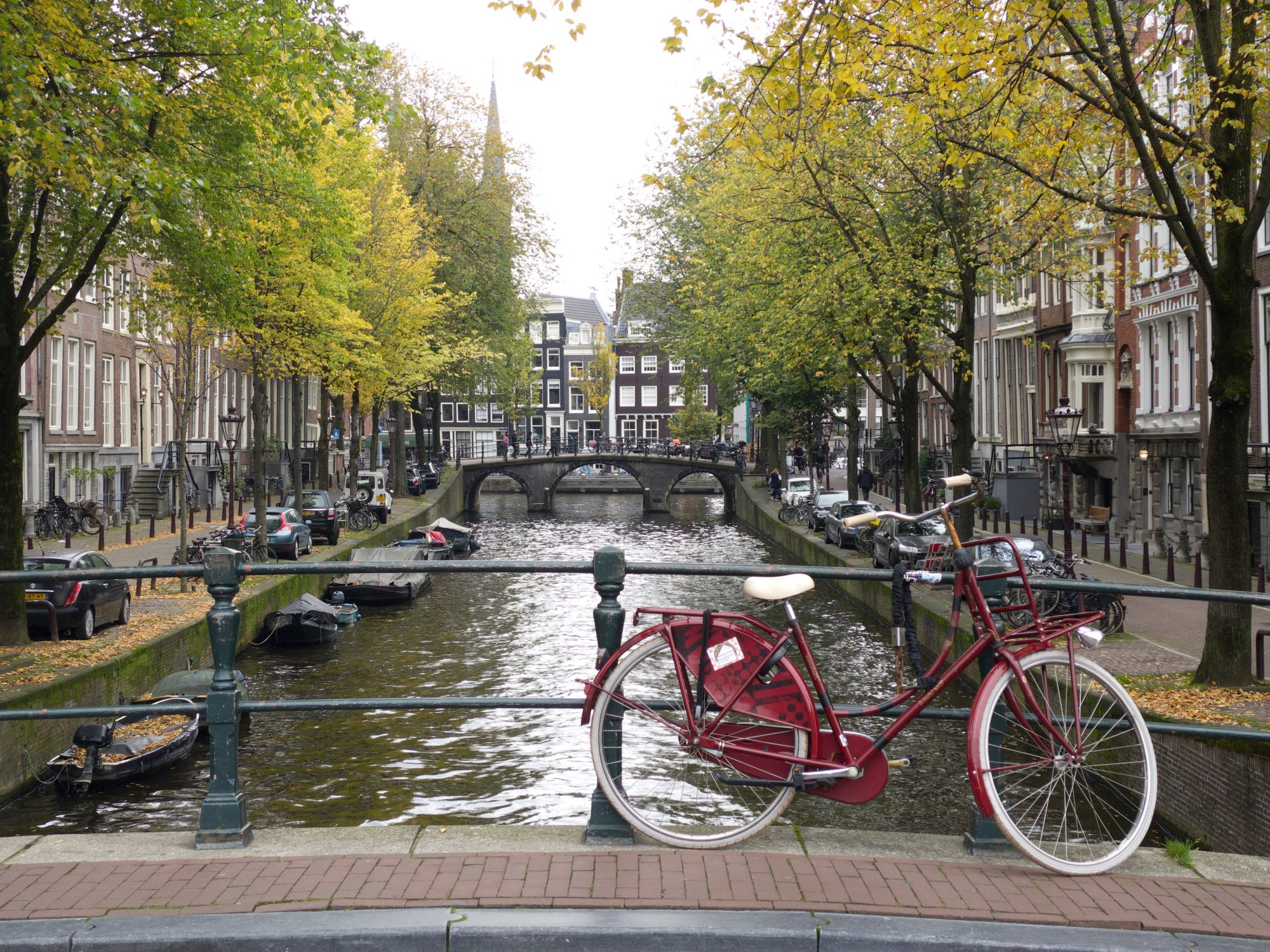 A bike parked on a bridge in Amsterdam.