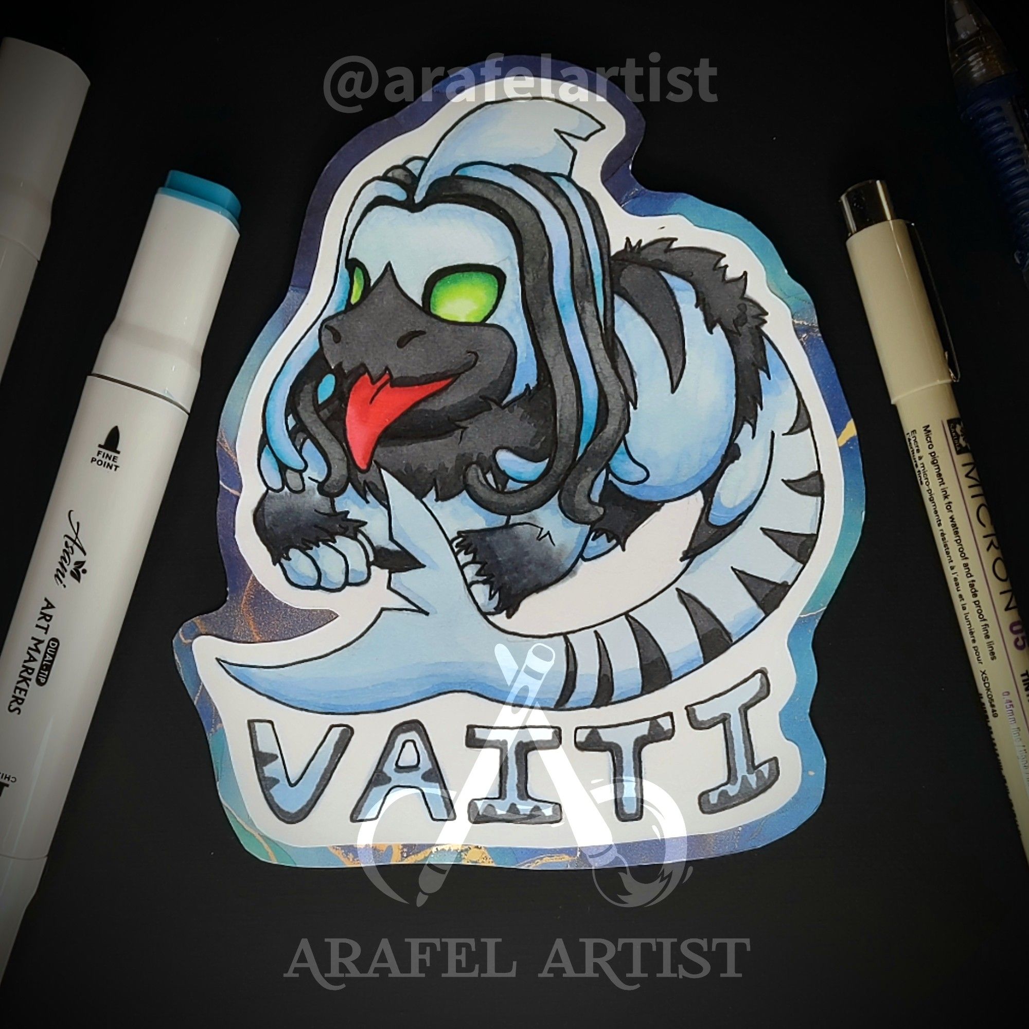 A blue and dark grey character that is part puppy part shark. It is four legged with a long shark tail, green eyes and a shark fin. They have black and blue dreads. The name Vaiti is written underneath.