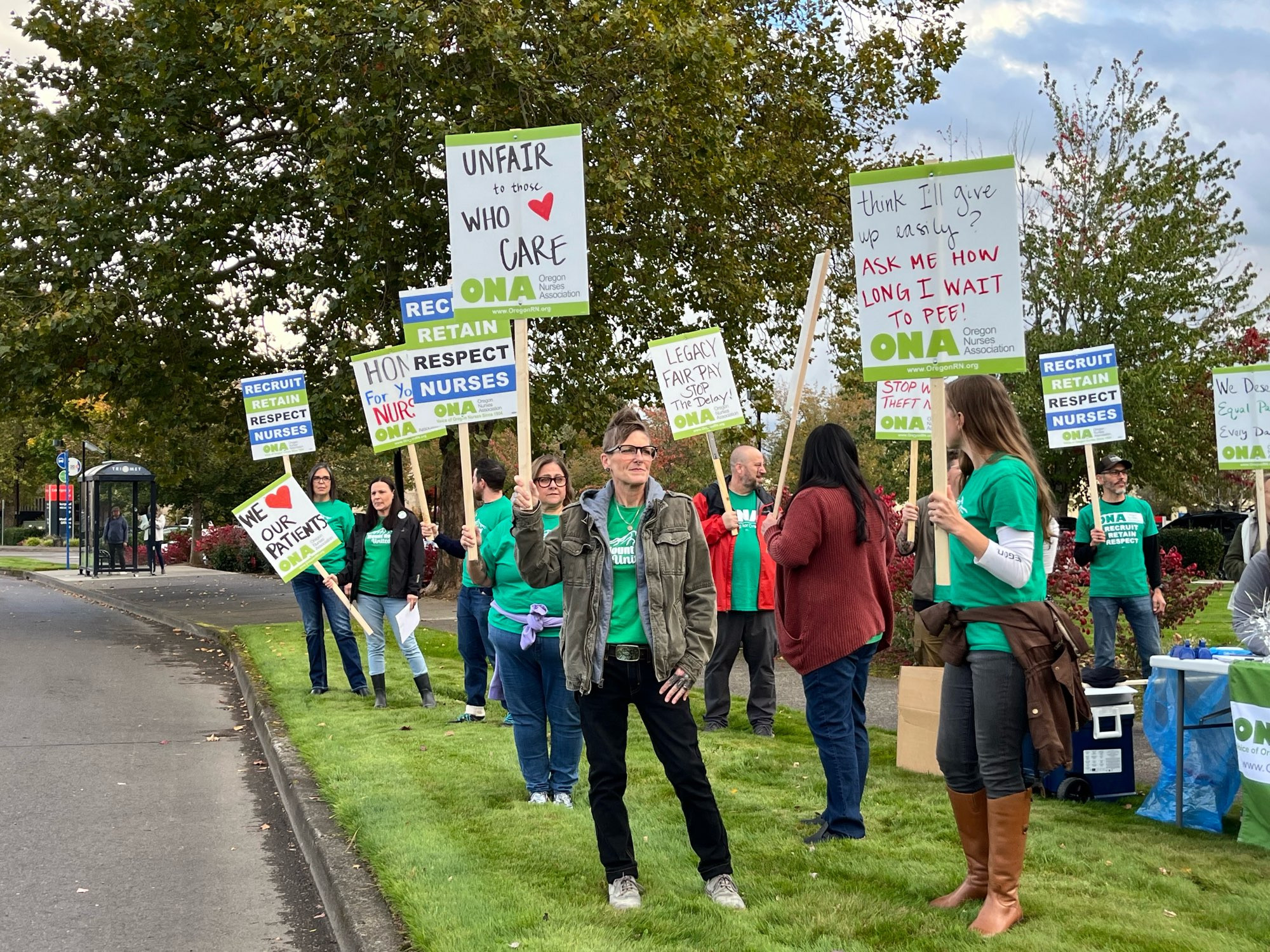 Nurses holding signs at an informational picket.