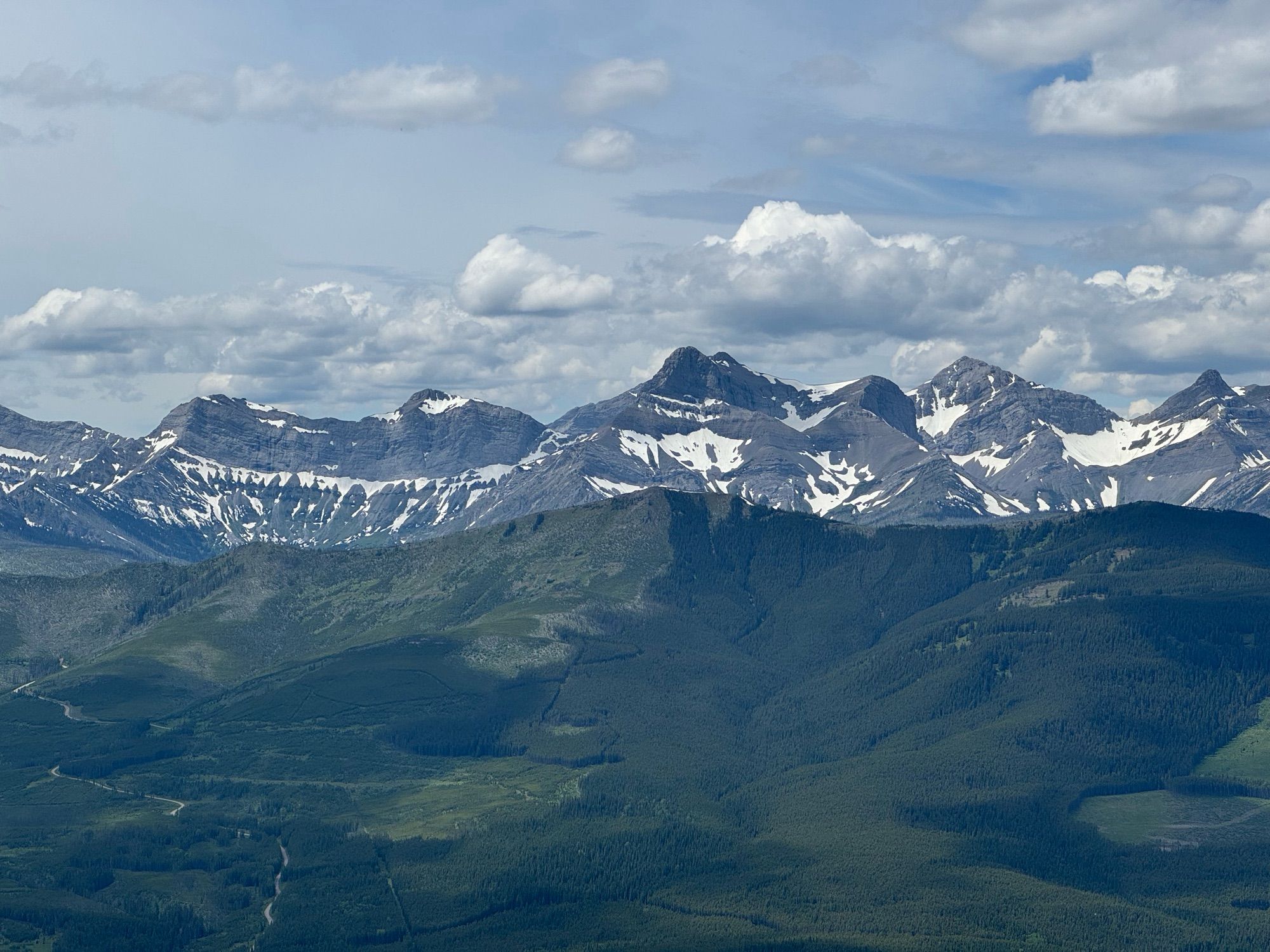 Mountain range with some snow near the top with the rocks