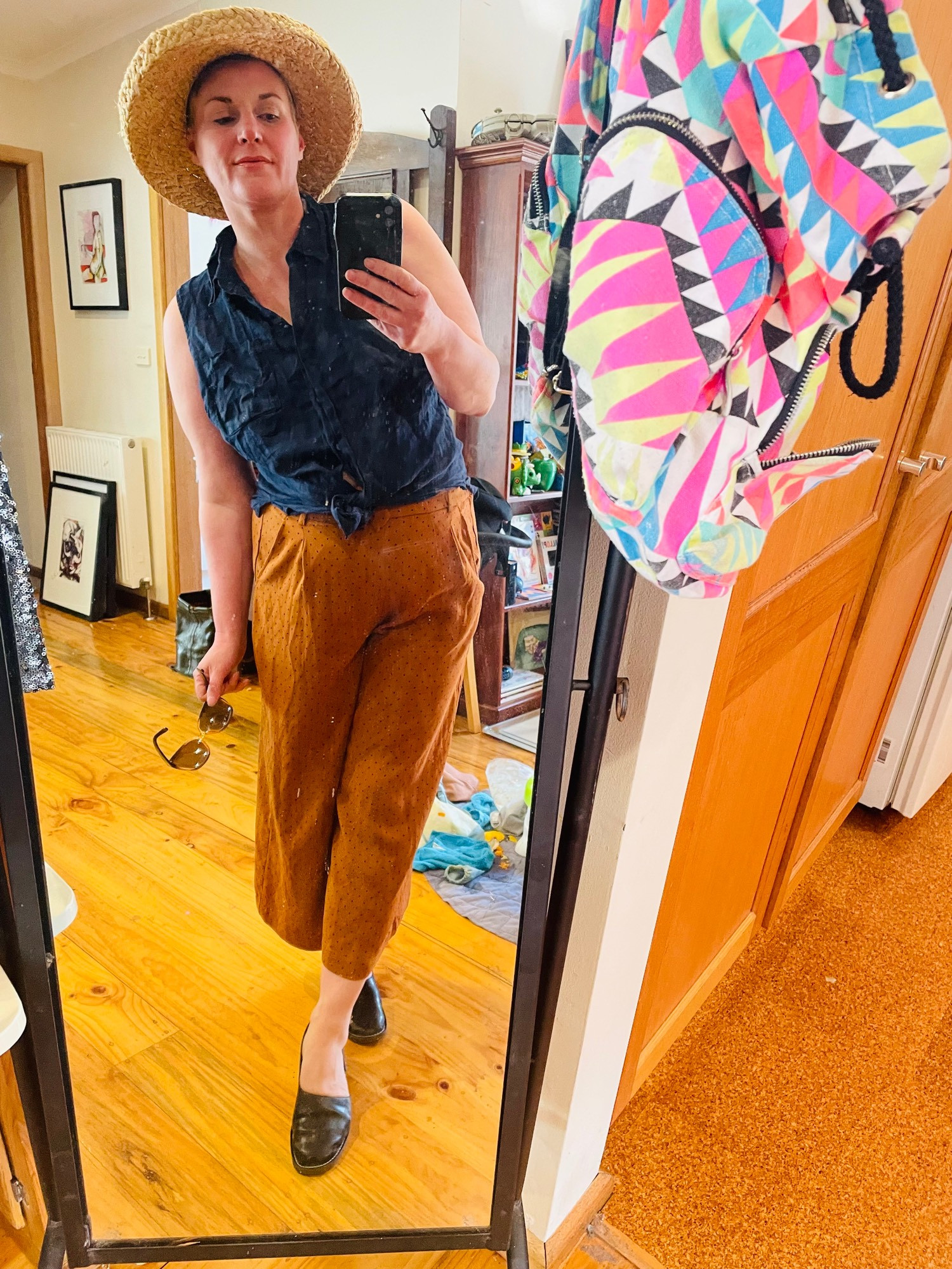 Blue collared short no
Sleeves top tied at the waist 
3/4 loose pants 
Black flats and a wide brimmed straw hat  

Its time to go to the market 