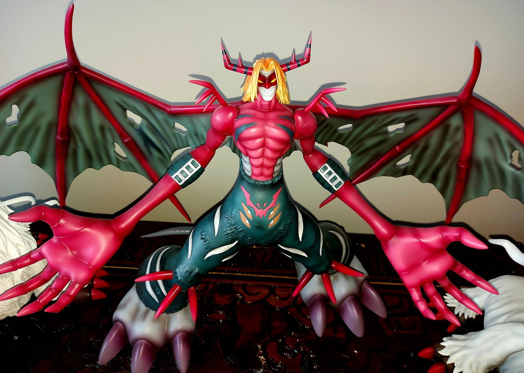 An unofficial digimon (VenomMyotismon) resin figure. He is standing with wings and arms outstretched.