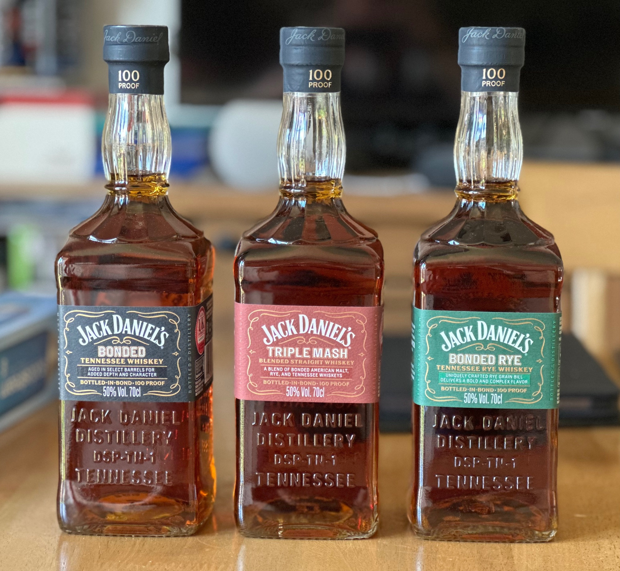 Three bottles of Jack Daniel’s whiskey from their bottled in bond range: Bonded, Triple Mash & Bonded Rye.