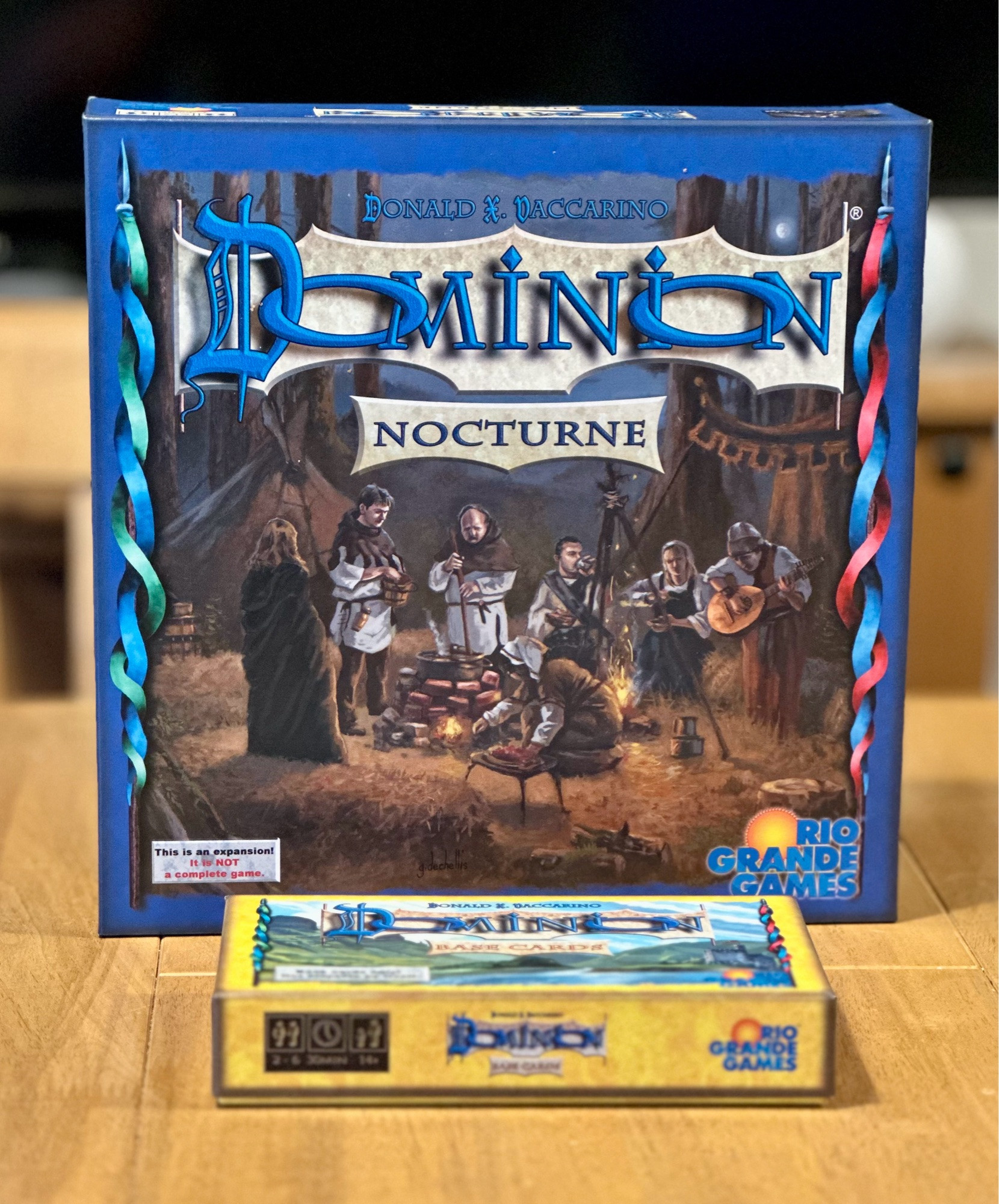 The Dominion expansion Nocturne with the base cards box laying in front.