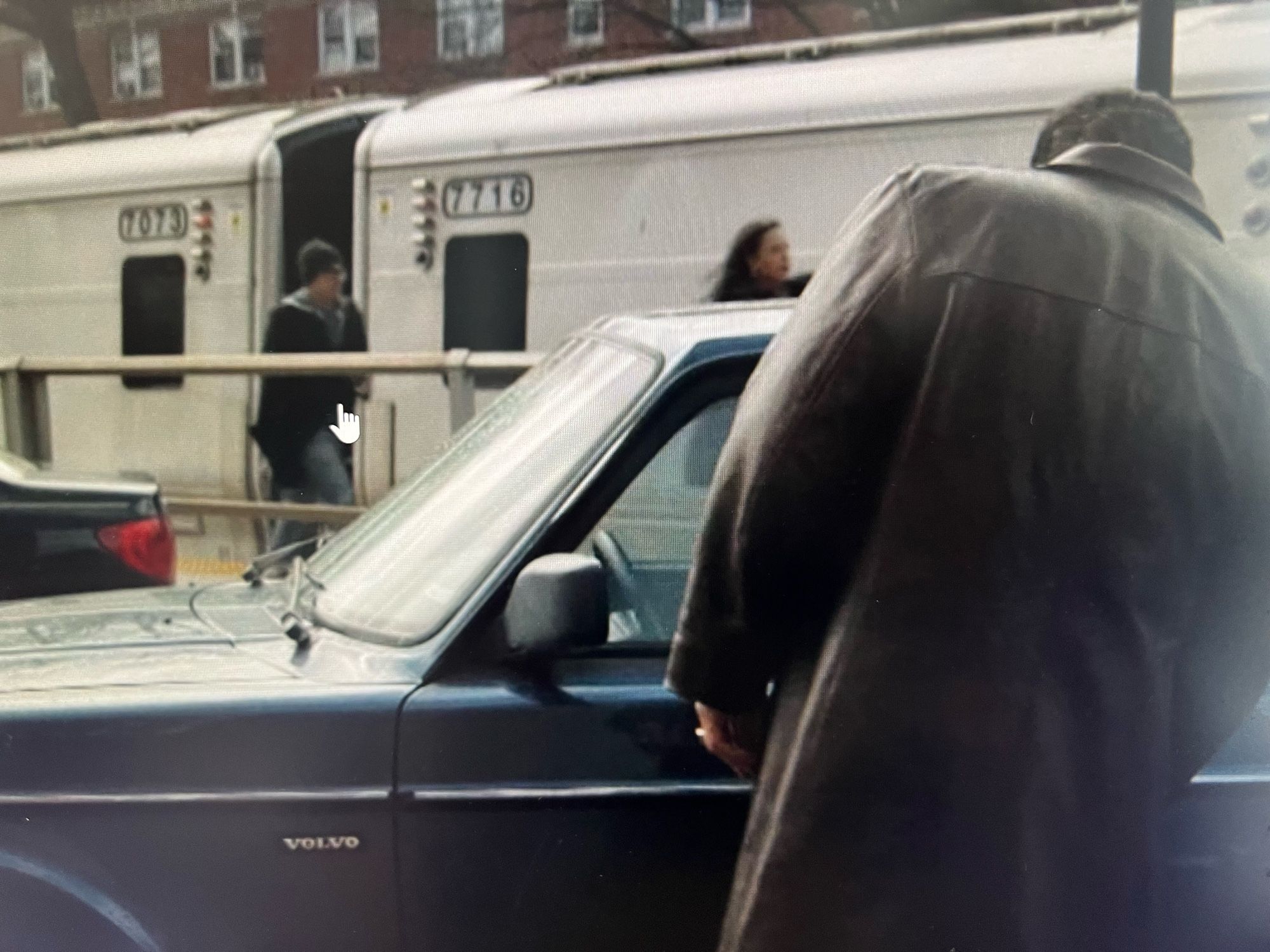 A photo of a frame from The Penguin (tv show) episode 1. The penguin is about to get into a car, which has a clearly visible Volvo logo (Just the word ‘Volvo’) on the side