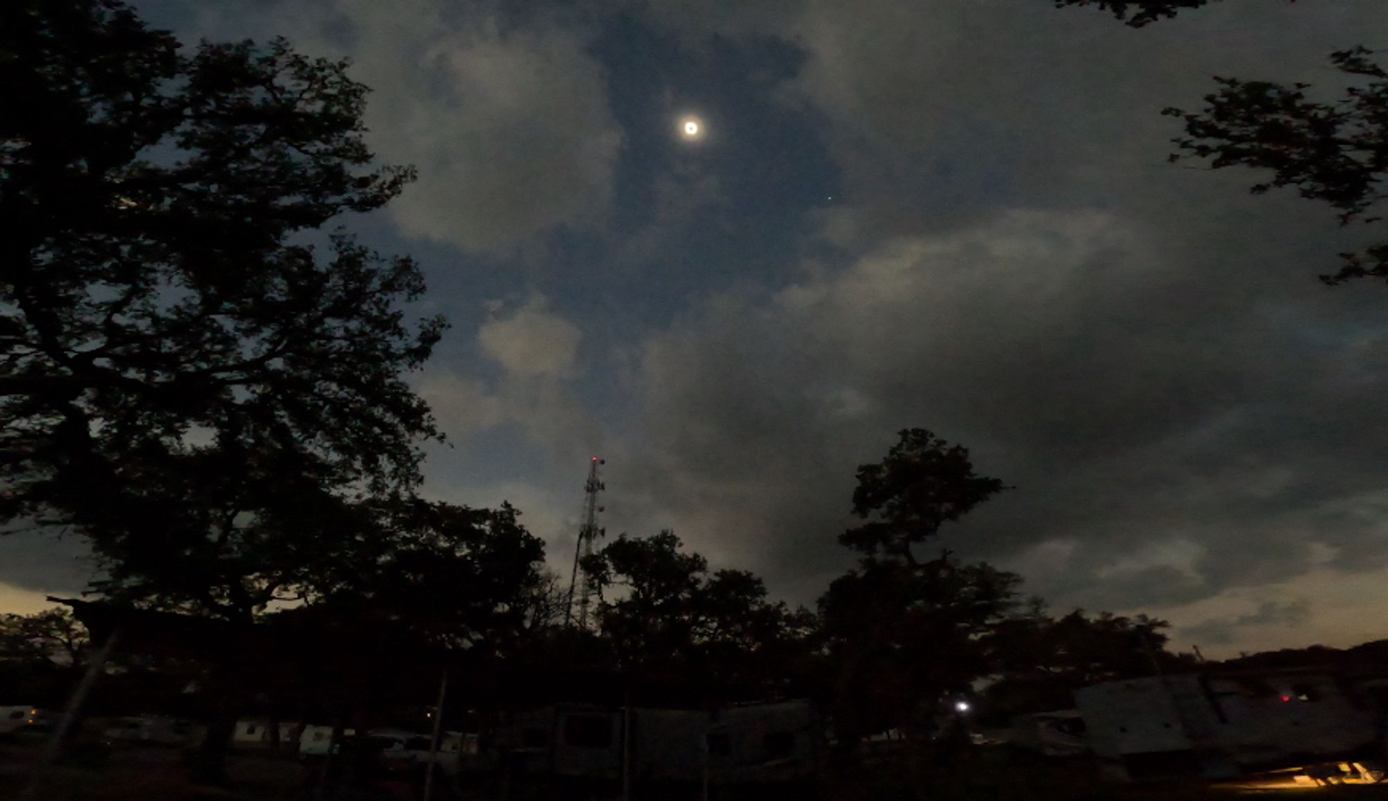 Wide angle picture of our eclipse location showing a small break in the clouds allowing us to view the totality