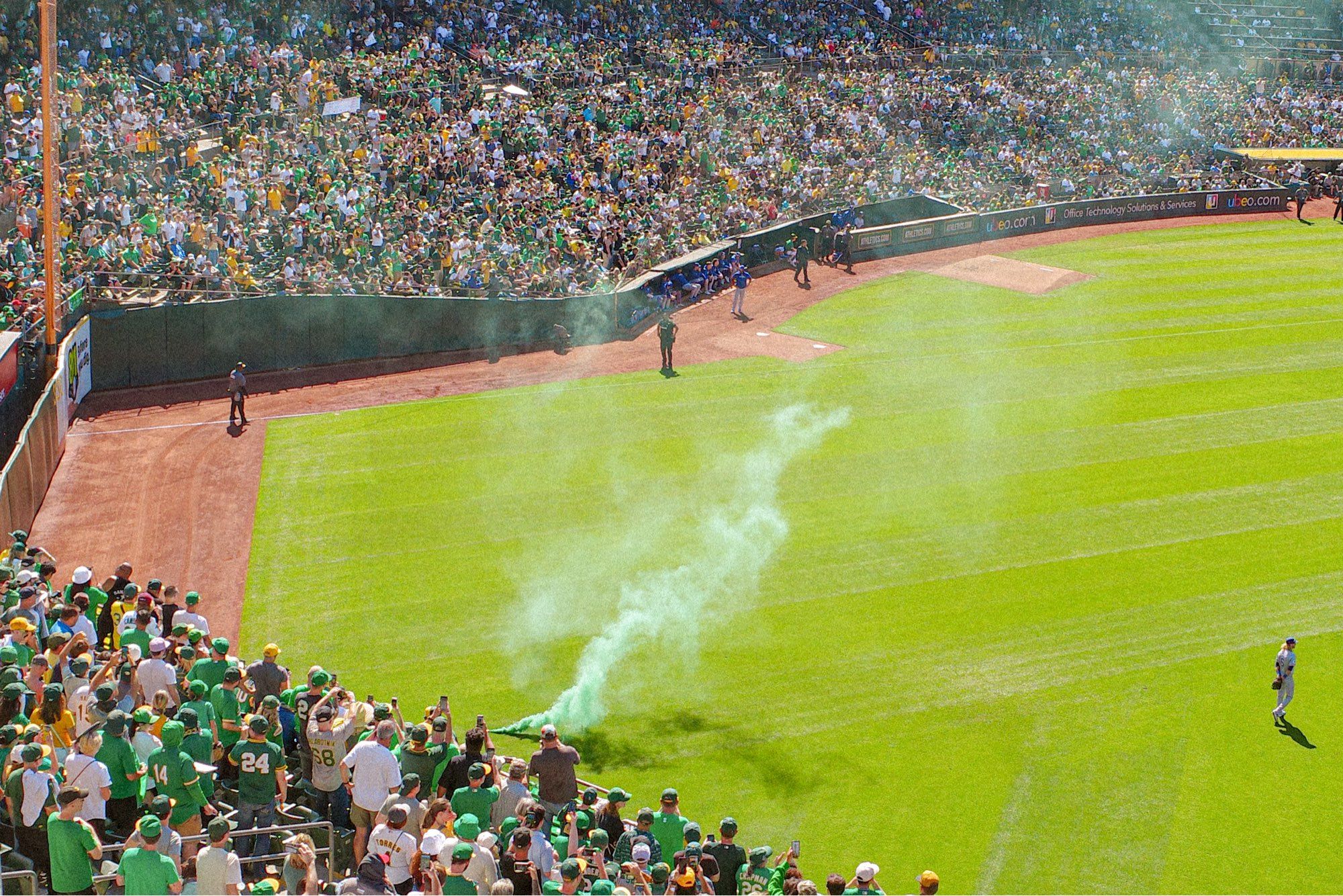 A smoke bomb going off in the right field grass below the bleachers.