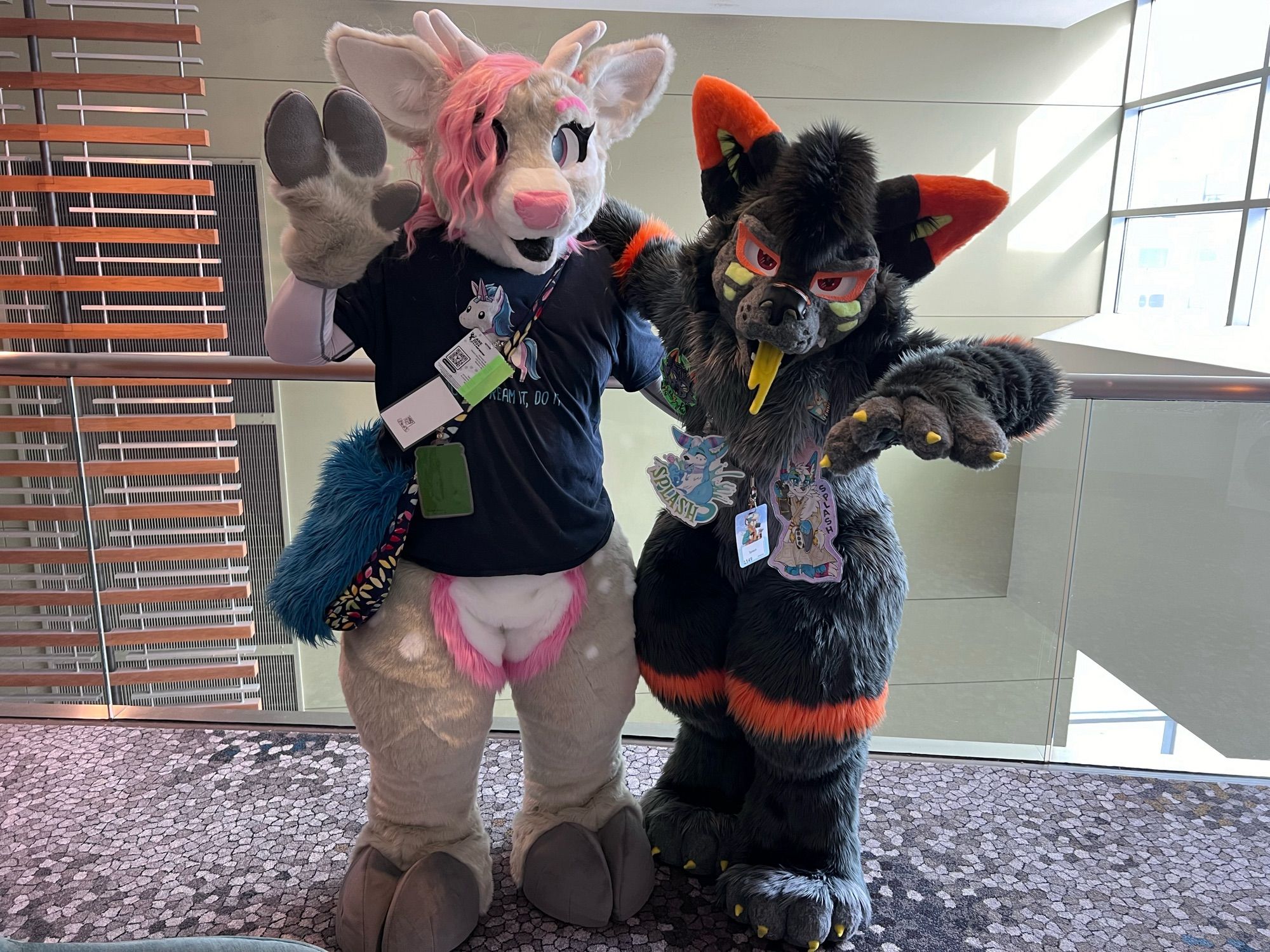 Lybeth and Splash posing outside the photo room at ANE 2024