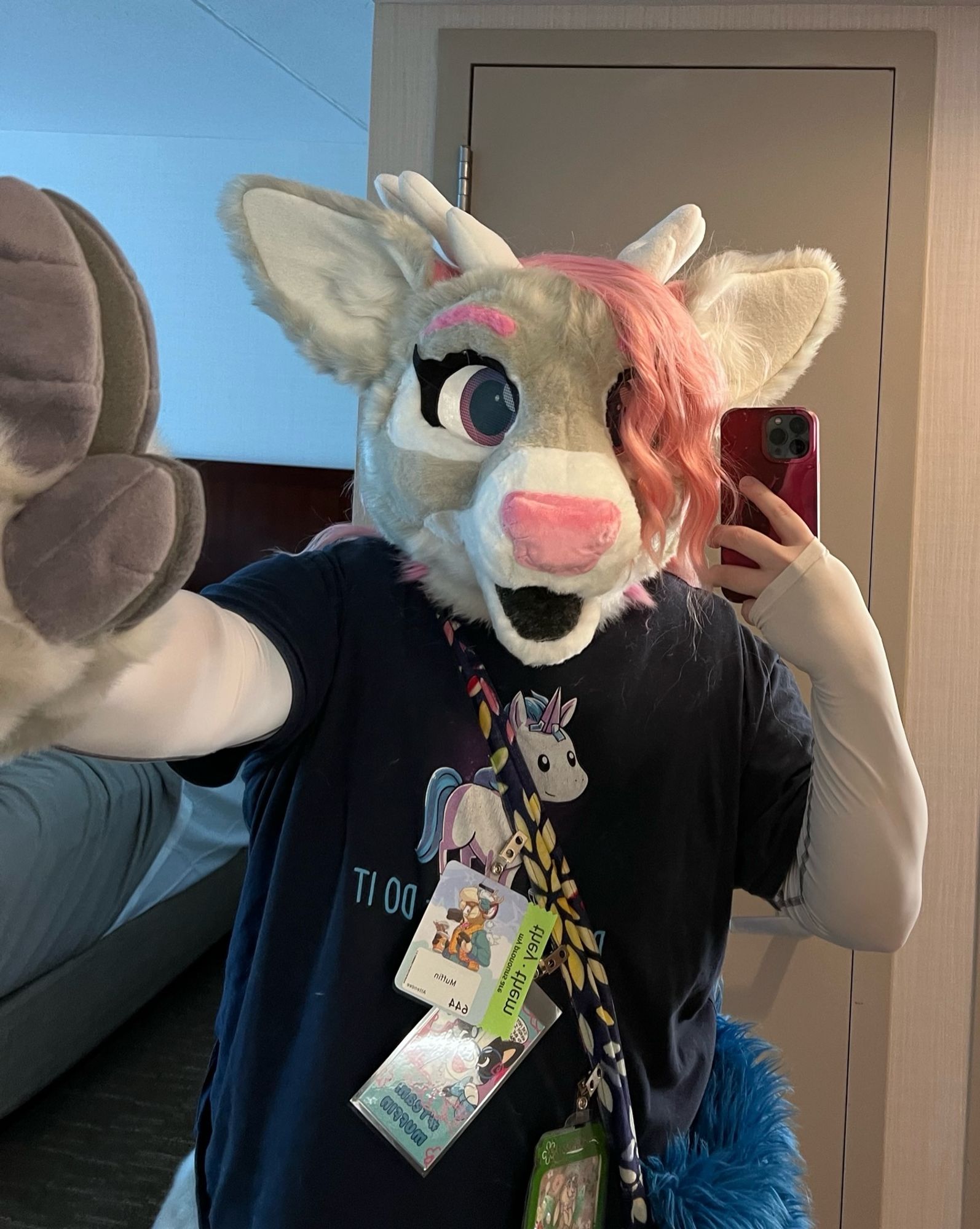 Lysbeth deer fursuit doing a wall slam against the mirror.