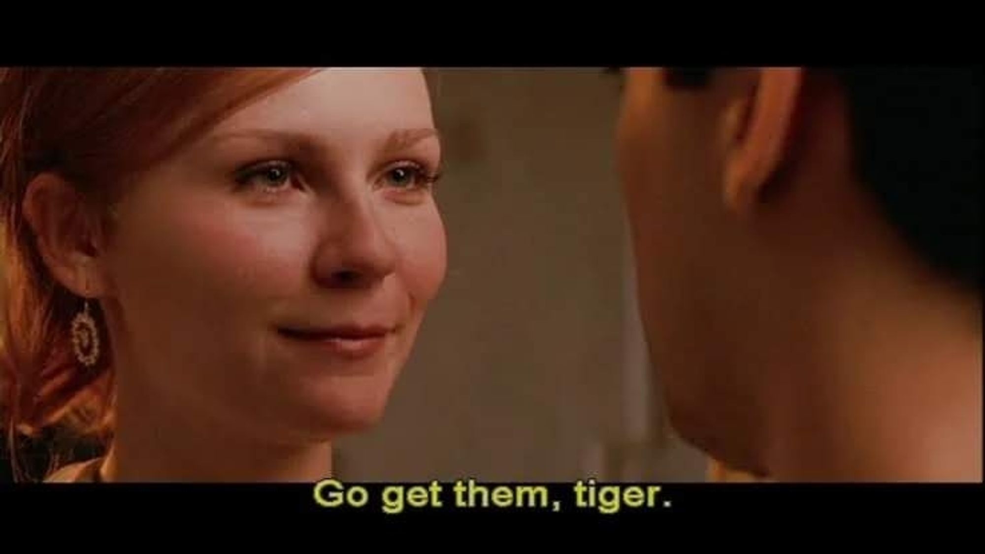 Still from the first Spider-Man movie of Mary Jane saying "Go get 'em, tiger."