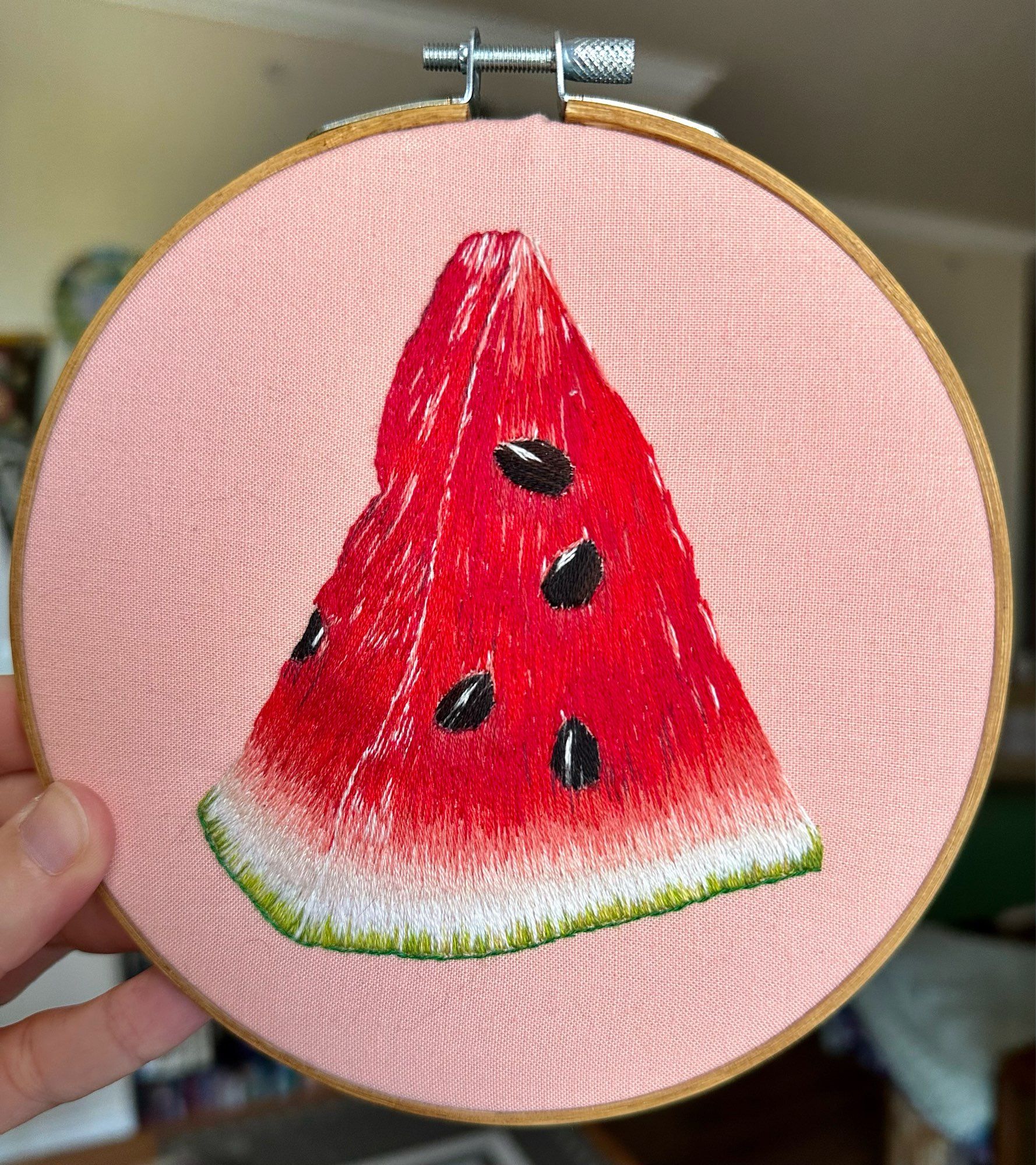 Embroidery hoop art of a watermelon slice