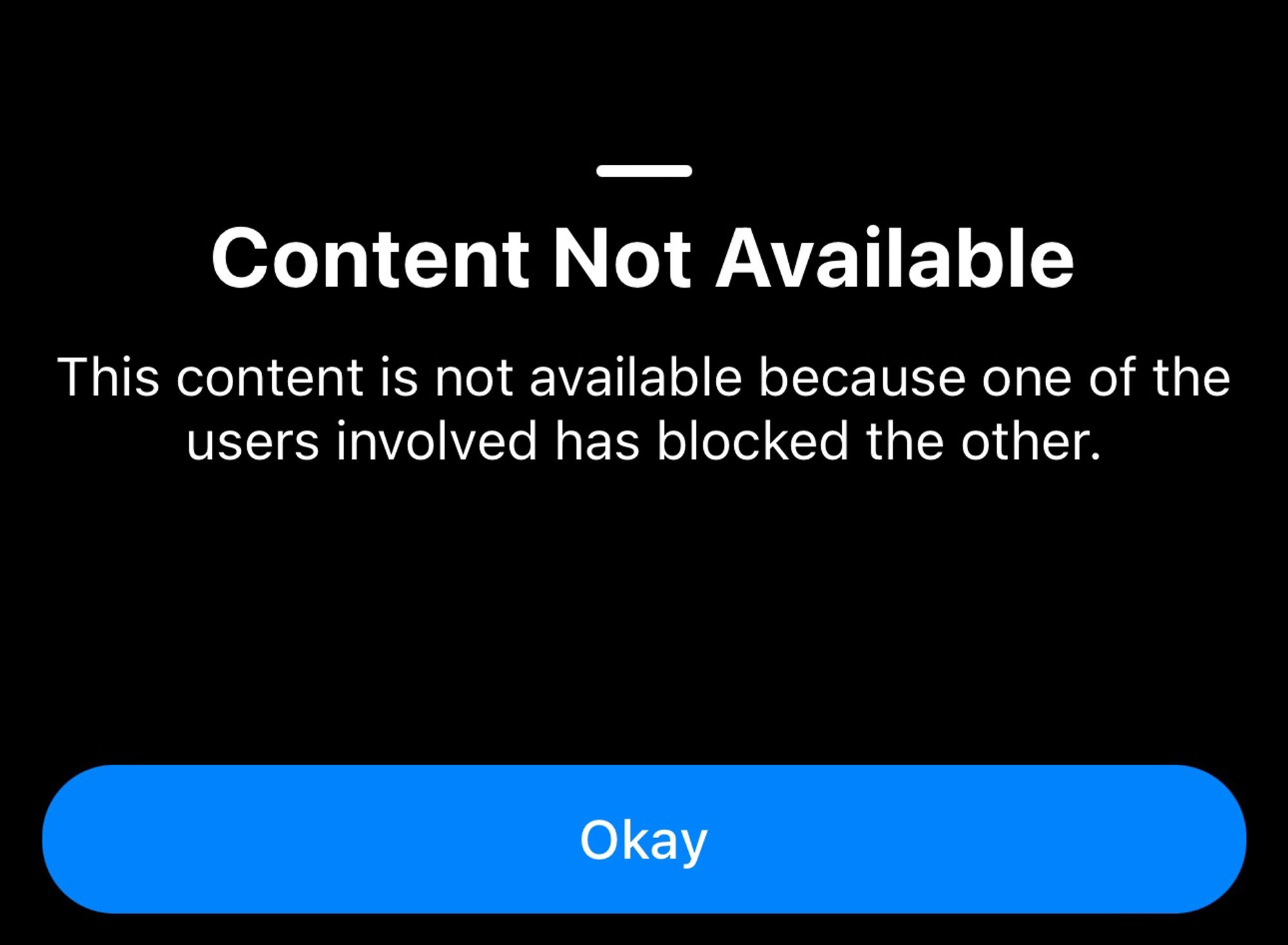Bluesky notification reading "Content not available. This content is not available because one of the users involved has blocked the other" and a button reading "Okay"