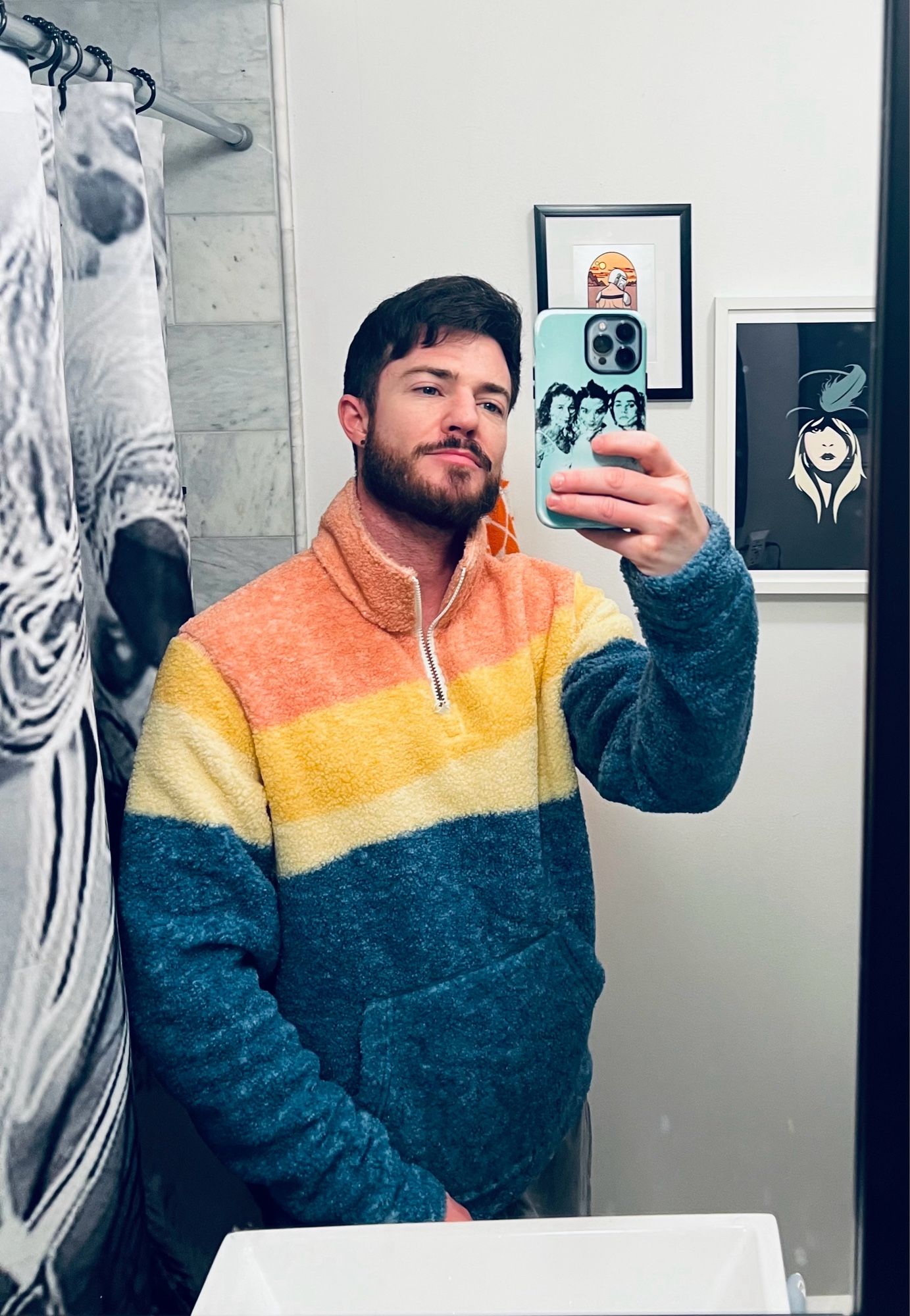 selfie in a fleece zip up with orange yellow and teal