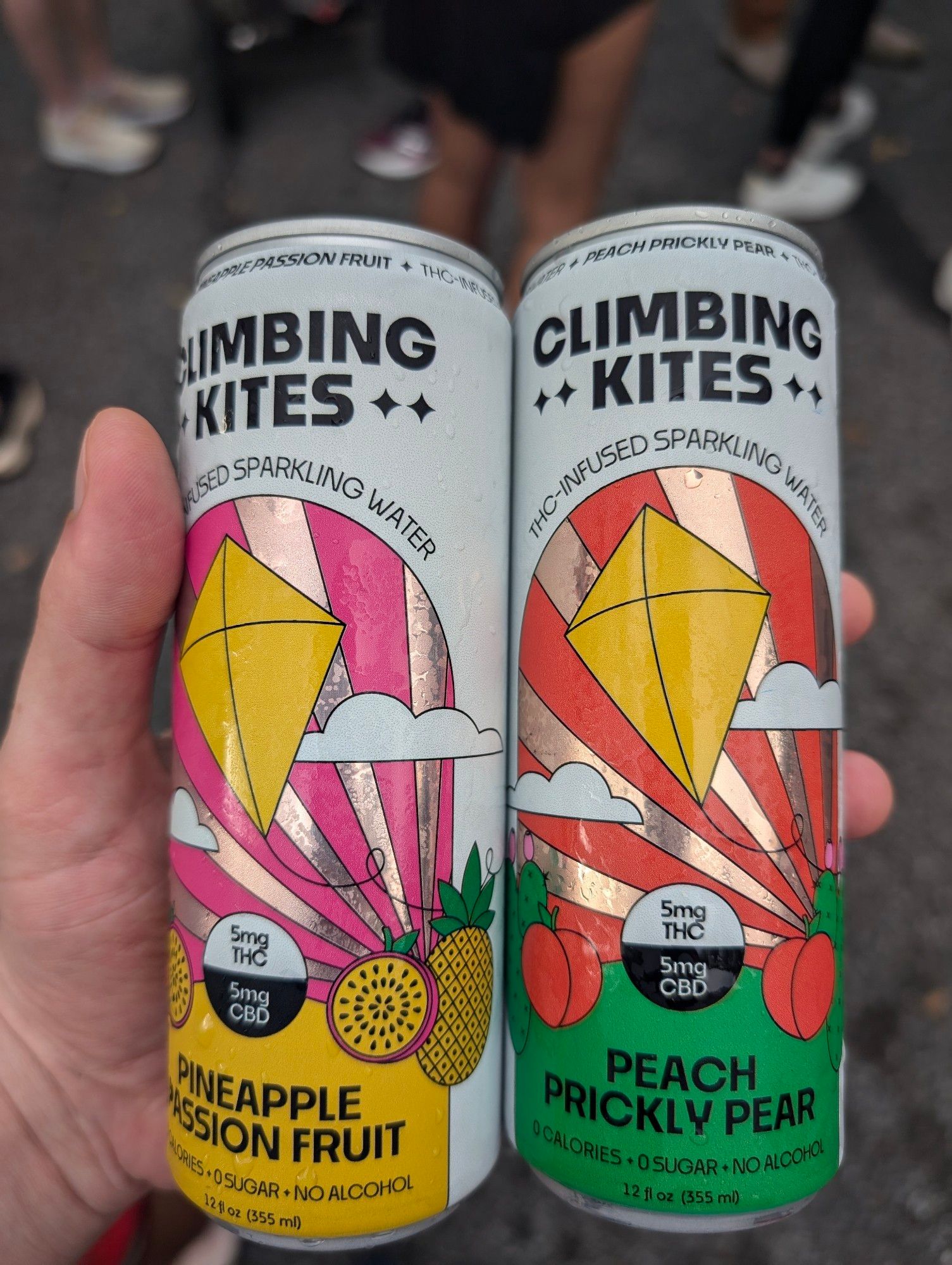 two climbing kites 5:5 mg thc:cbd seltzer drinks, one pineapple passionfruit one peach prickly pear. all the P fruits I guess