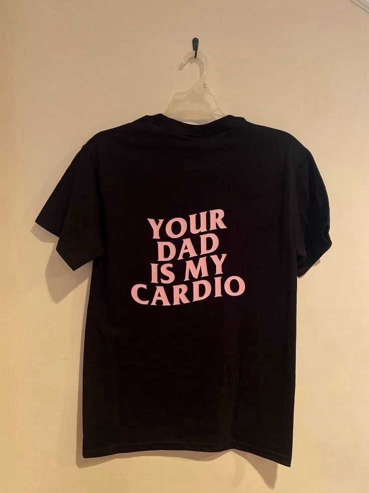 Black t shirt with pink lettering that says your dad is my cardio