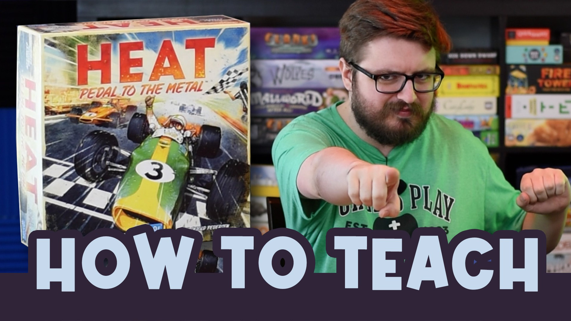 A video thumbnail of an incredibly handsome man pointing excitedly at the screen. A copy of the board game "HEAT: Pedal to the Metal" is visible beside him.