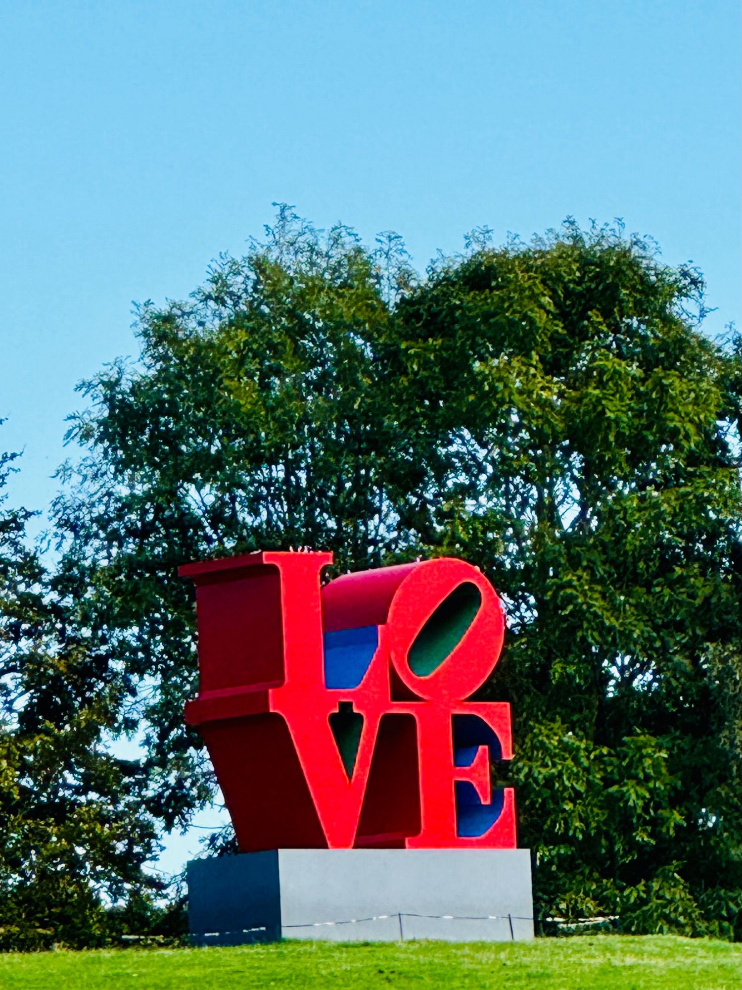 Photograph of Robert Indiana’s LOVE (Red Blue Green) sculpture, at Yorkshire Sculpture Park.